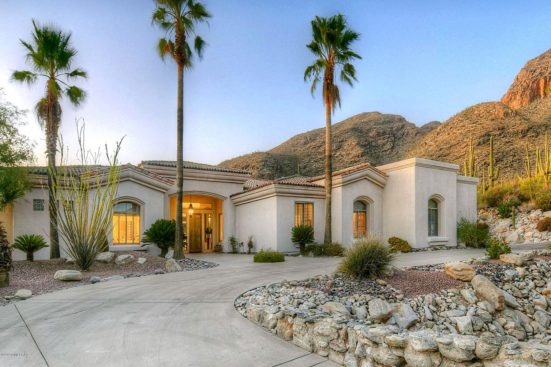 In prestigious, gated Cobblestone at the top of Campbell Ave., this 4,372 sq. ft. 4 bedroom, 3 car garage home is located on a cul-de-sac at the top of the subdivision with sweeping mountain views from the rear yard, family room, kitchen, and all on one level with no interior steps.  Circular driveway leads to foyer and living room with soaring ceiling and walls of windows.  Cozy family room/kitchen with fireplace, soaring ceiling, walls of windows and views offers center-island, white cabinets, breakfast nook, pantry, wet bar with sink and fridge.  Gracious master suite features dual vanities, walk-in closets, walk-in shower plus spa tub.  Expansive rear porch and fenced yard offers pool, gazebo, built in BBQ, outdoor kitchen, views, views, views and so much more.  See to appreciate.