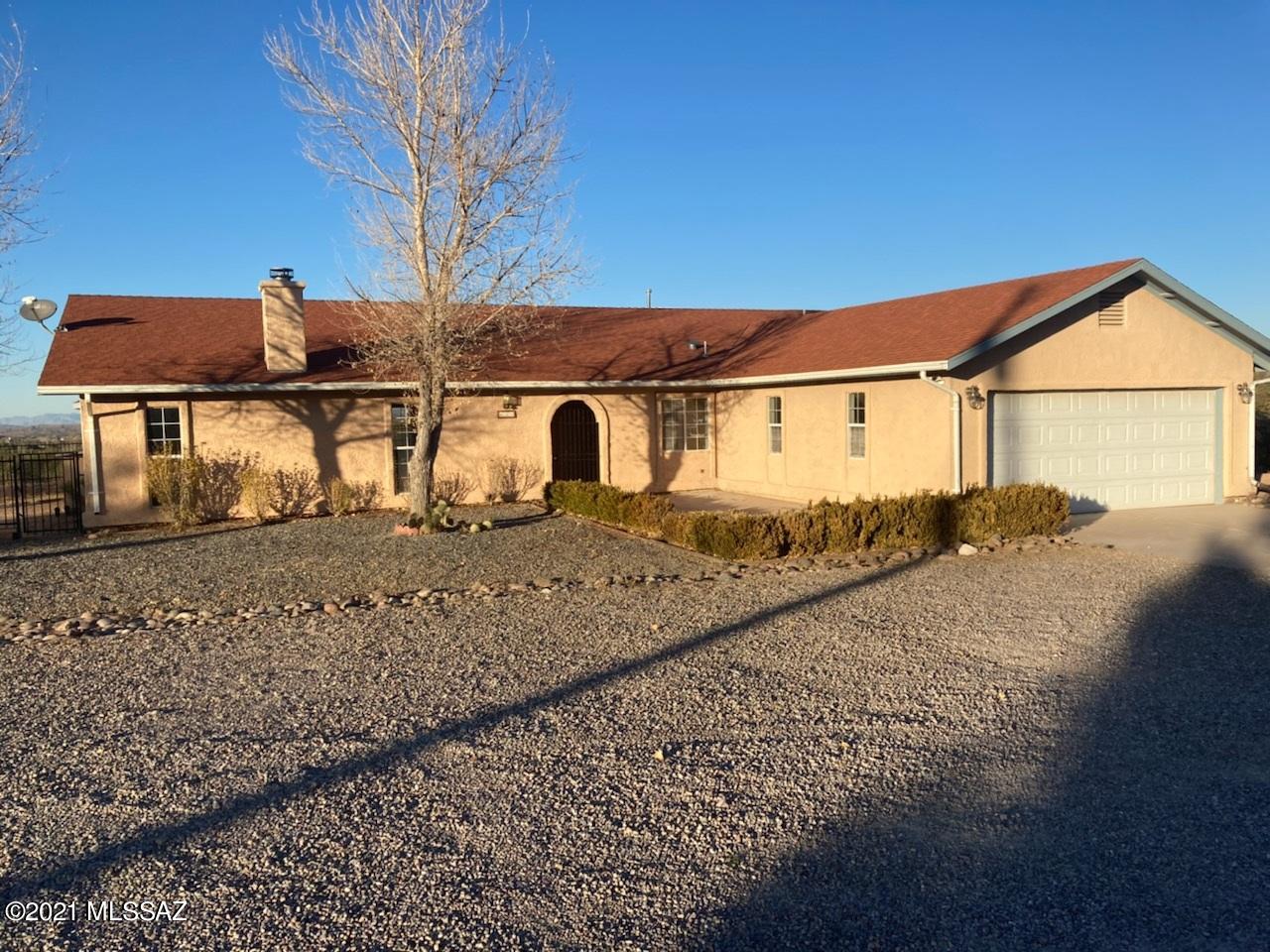 This fine ranch style 4 bedroom offers it all!  Location, large easy care lot, excellent views, appealing floor design.  Covered patio allows for all weather entertainment or peaceful personal enjoyment!  Split floor plan like no others!  Many upgrades (central vac & instant hot water) not to mention vaulted ceiling, sunken living area and gated front entry.  A must see to appreciate!!