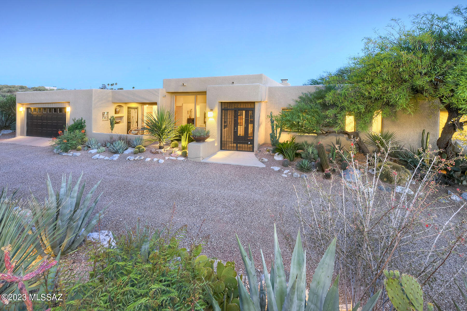 Stunning soft contemporary designed by Tyson-Murphey w/city & mtn views on 1.3 acres in Catalina Foothills Est. 9 , long private driveway, foyer entry, exquisite living room w/high beam ceilings, walls of windows, charming fireplace, formal dining room, gourmet island kitchen w/granite countertops, stainless steel appliances, fridge, large pantry, lovely breakfast area. Light & open Family room, beautiful tile floors & French doors, 3 bedrooms+study w/built-ins or 4 bedrooms, 3 baths including Master w/sitting area, fireplace, walk-in closet, bath w/fitness area, travertine tile floors & talavera tile countertops, laundry room w/washer & dryer. Enjoy the resort like backyard w/covered patio, pool, tiled fountain, lush landscaping, serene privacy, indoor & outdoor living & Dist.16 Schools.