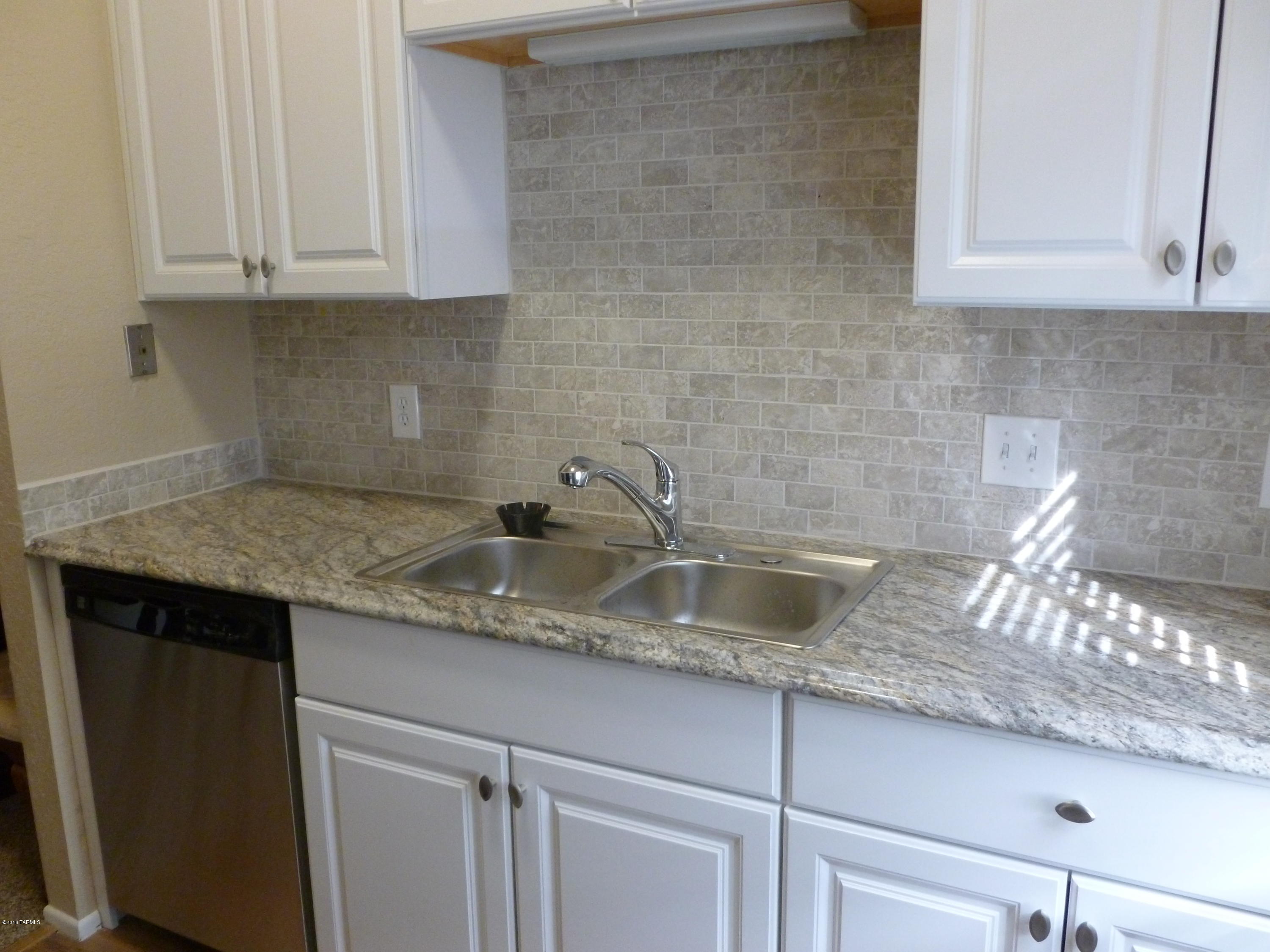 COMPLETELY RENOVATED 2 BED 2 BATH CONDO! NEW A/C AND HEATING UNIT (GAS PACK), NEW CARPET, NEW LAMINATE FLOORING, NEW DISH WASHER, NEW STOVE, NEW MICROWAVE, NEW WINDOW COVERINGS, NEW CABINETS, NEW fRIDGE, COUNTERS AND SINKS IN KITCHEN AND BATH ROOMS, NEWLY PAINTED.2 community pools (one adult only heated pool),and hot tub. keyed entry laundry facility just steps away! 
2nd floor unit, nice high ceilings!Come take a peak!

One the owners is a licensed real estate in Arizona