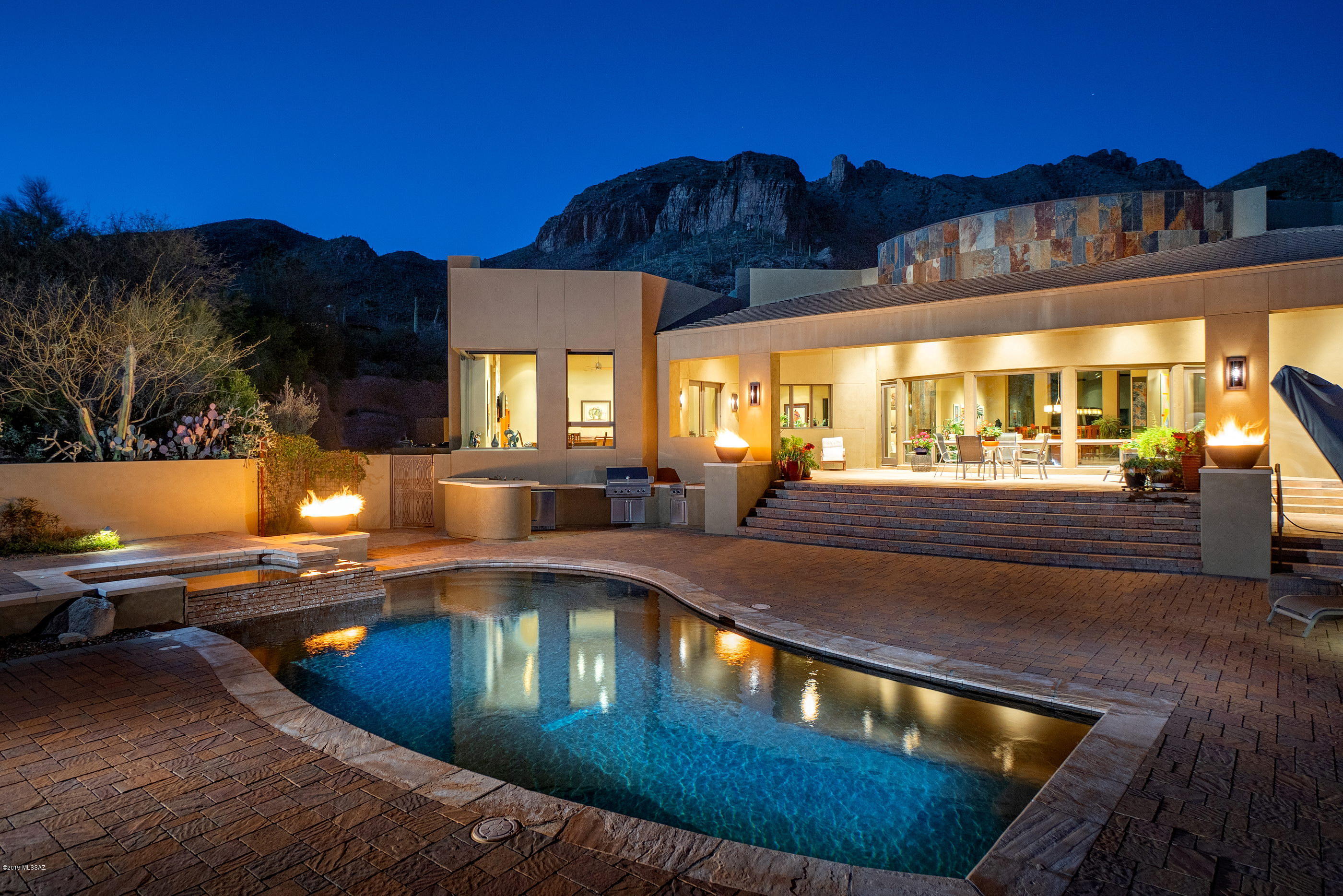 Situated behind a private guard gated entry, in the exclusive neighborhood of The Canyons, synonymous with luxury and elegance. A design collaboration between Becklin Construction, Mary Alexander-Designer and Larry Zukowski landscaping, composed a building typology that is designed to achieve private interiority within a neighborhood context. Complemented by a limited palette of materials strengthens the timelessness of the design, providing a contemporary range of subtle elegance, with balanced finishes, enhancing and harmonizes the flow of spaces, with attention to detail evident in the extensive list of custom designed features.