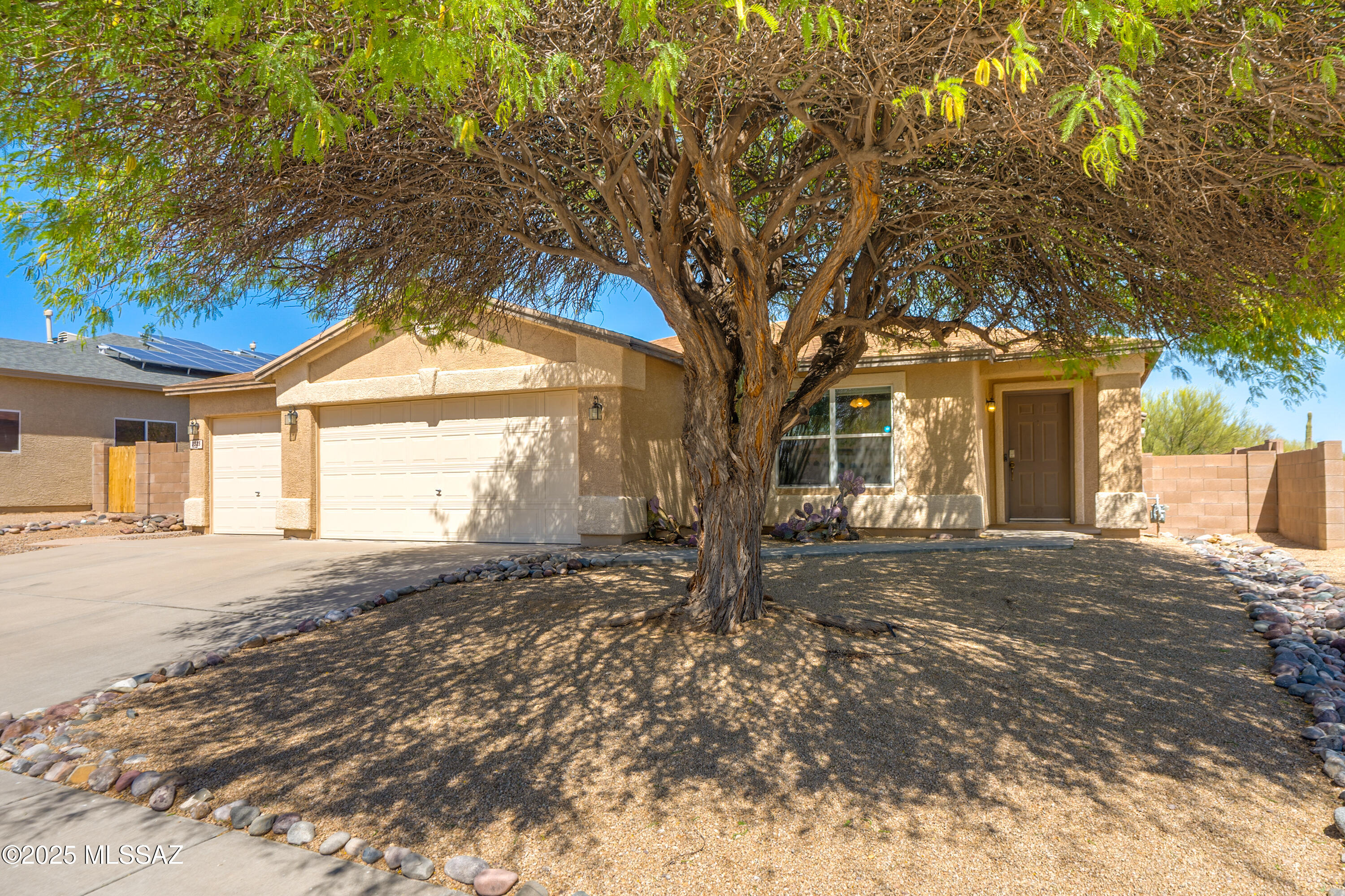 ''Tucson Mountain Sanctuary'', Established Neighborhood, Backyard Privacy & View Lot. 1579 sqft., 3 Bedroom, 2 Bathroom, w/3 Car Garage! Entry Foyer Area into Living Room flows to Dining Area & Kitchen. Kitchen features SS Appliances, Refrigerator (New 2025),Double Oven (Convection oven, Induction Cooktop), Microwave, Dishwasher. Lots of Counter space & Cabinetry. Center Island offers Bar Seating. Nice size kitchen Sink w/Backyard facing Views. Combo Pantry & Laundry room off Kitchen. AC was replaced in 2021. Original Dual Pane Windows. Hot tub is non-functioning. Great Backyard space as it is or create your own Vision! Privacy & Gorgeous Natural Vegetation Views through the Backyard View Fencing adds extra Privacy & Beauty to this Home. With a little TLC this home could be Extra Special!