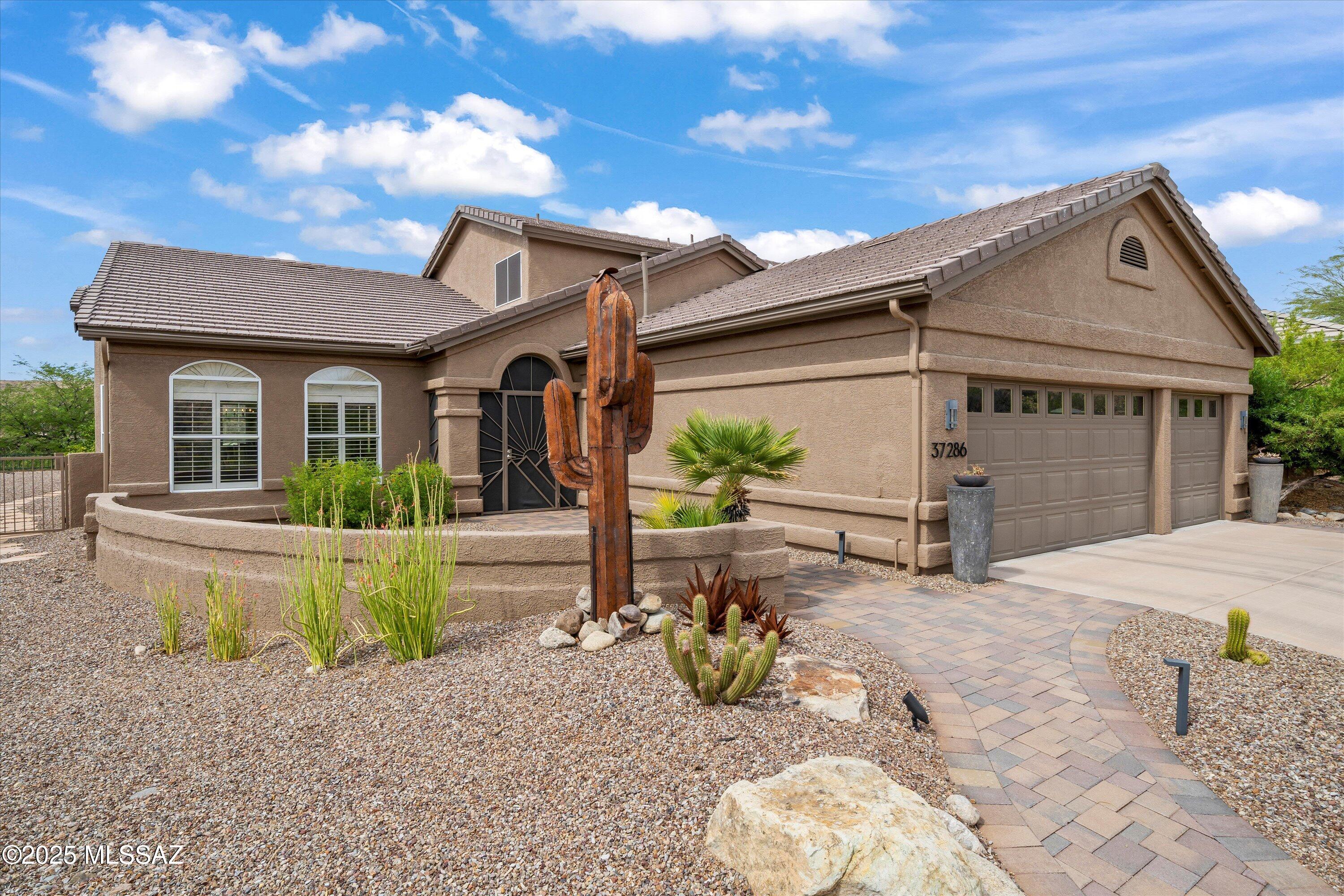 This beautifully renovated and upgraded Galleria model is ready for move-in. The double door entry leads to an inviting neutral color palette that enhances the spacious gathering and formal dining room. The island kitchen maximizes the open floorplan, offering ample cabinetry, two refrigerators, an induction cooktop, and views of the yard and surrounding open space. The expansive family room features a stacked stone fireplace, providing warmth during cool SaddleBrooke evenings. The owner's retreat includes a sitting area and an en-suite with double vanity, a walk-in shower, and double closets. Upstairs Casita offers two bedrooms and a bath, ensuring privacy and comfort for guests. Additional highlights include a convenient full bath in hallway, 4th bedroom downstairs, a den/office, a three-car garage, and a new roof installed in 2023 with updated roof tiles. Outdoor spaces feature a covered patio with commercial grade heaters, expanded hardscape, and a raised patio, ideal for entertaining or enjoying all that SaddleBrooke has to offer.