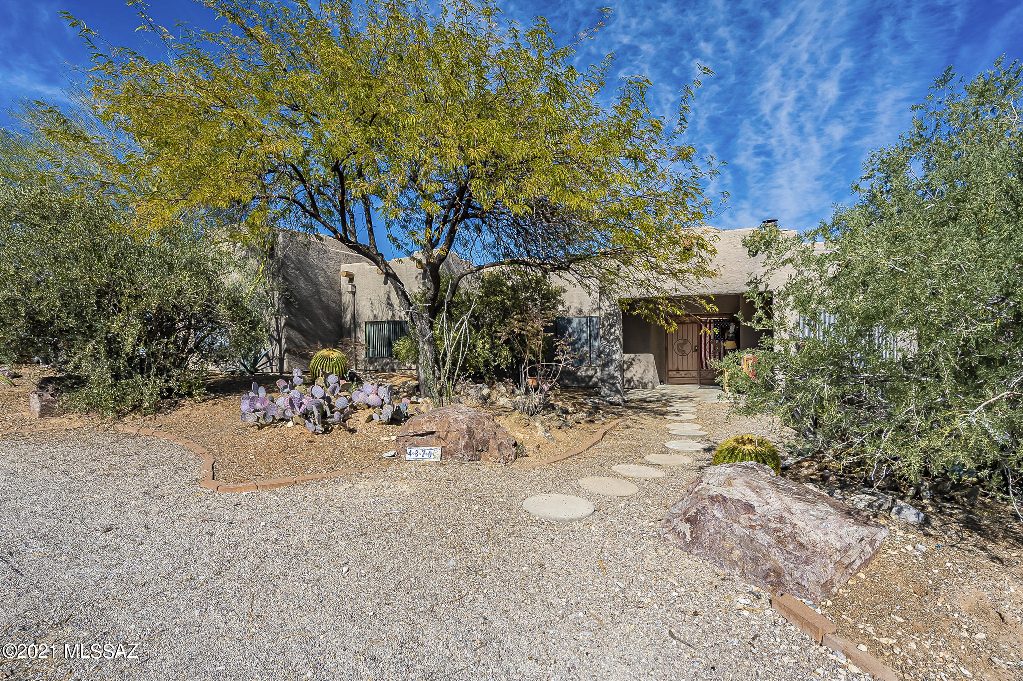 A must see home with...Views views views! Come home to beautiful mountain and city views you would never think you were still just minutes away from the exciting nightlife of downtown Tucson, University of Arizona, tasteful restaurants and local grocery stores. Enjoy perfect sunsets, colorful sunrises and the sparkling city lights that backs to the desert museum. with 2 ac unites and $75,000 in owned solar panels.