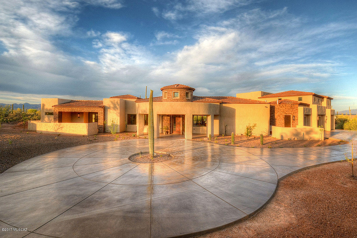AMAZING 7,113 SqFt custom home resting on 3.31 acres! Main house and guest house with a total of 6 bedrooms and 6 bathrooms! This home was built to highlight the surrounding desert vista & incredible mountain views. Spacious formal living room features a striking stacked-stone fireplace & is perfect for
entertaining. The gourmet chef’s kitchen features granite countertops, gas stove-top, soft-close cabinets,
& a large pantry. The 10-foot disappearing glass sliding wall in the dining area ties to the resort sized patios overlooking the city lights & mountain ranges! Come see everything this magnificent home has to offer!
