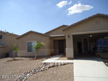 This is a 4 bedroom 2 bath home that backs up to desert and mountain views. It has a good sized lot with low maintenance landscaping. the floor plan is spacious and open. Close to Arizona Pavilion and the premium outlet mall.