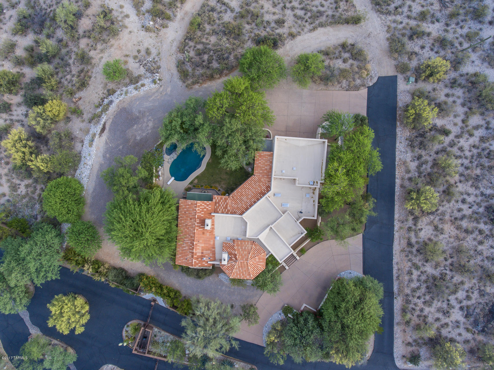 2xTAR Tour Winner ! Rare opportunity in gated Colonia del Sol, prime Foothills with easy commute UofA, Banner, walk to Hacienda del Sol.  Oriented to maximize mountain & city views to enjoy year round resort style living & entertaining. Sound wired in and out.  Quality masonry construction, cantera details and soaring ceilings.  Split plan. Two fireplaces. Polished, scored concrete floors, beamed ceilings.  Large covered wrap around patio with great flow.  Additional private patios shaded by mature trees.  Master has retractable awning.  Kitchen has gas cooktop on center island with ample seating and storage.  Bonus space for wine cellar or man cave ready for your inspiration.  Plus room for the ''toys''.  Cool canyons. Short drive to La Paloma Country Club for golf, fitness, dining. New windows, carpet and fresh paint.  Pool has pop ups and new equipment.  Exposed aggregate driveways.  One owner.  District 16 schools. 

This home with acreage loves to spoil the owner.  Cozy and private inside the masonry smooth stucco walls.  Room to roam outside.  Perfect for tree and nature lovers.  Amazing sunsets and lots of creatures to observe.  Come up and see for yourself !