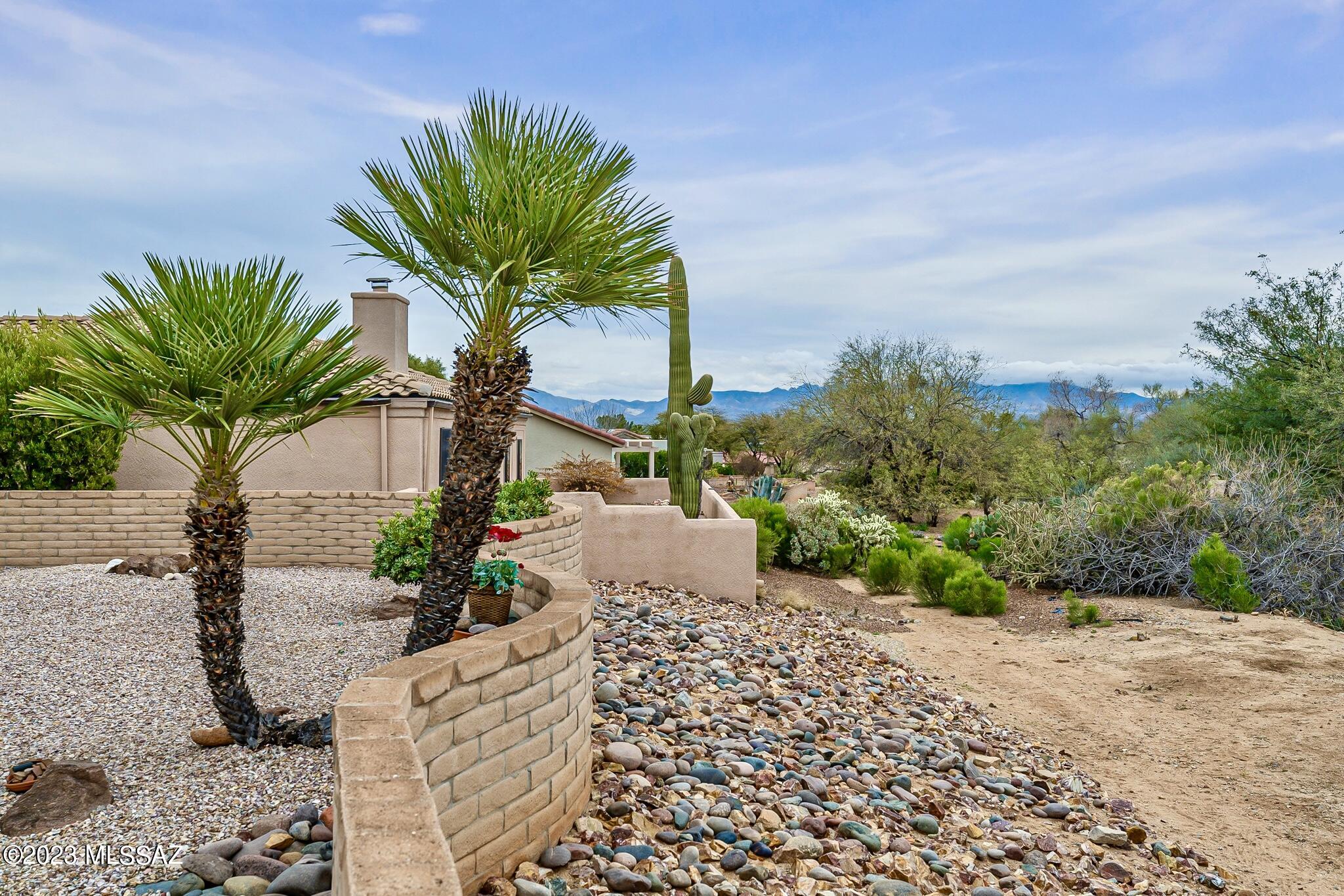 Welcome to another Green Valley GEM in the quiet, peaceful, & beautiful Portillo Place Subdiv. A small enclave of 28 homes developed by a quality & reputable home builder- Pierce Homes, known for the Fine Art of Living Well & LIVING WELL you shall! This home offers a private, calming, & serene bkyd where you can sit, relax, & enjoy the beautiful AZ Desert. Inside you'll be pleased to find an impeccably maintained 3bed/2bath home w/features incl. a charming & cozy lvng rm w/beehive fireplace, plantation shutters on kitchen windows, skylights, SS appliances, lazy suzan, pull out drawers, built in storage in ldry rm & garage, utility sink, water softener, walk-in shower & closet in the primary, beautiful ceramic tile throughout, split floor plan, and completley move-in ready! Plus, this home is part of GVR which means you'll have access to all 14 recreation centers incl. an award-winning, 24-court pickle ball center! The social activities & recreational opportunities available through GVR are endless!! So, if you're searching for a friendly, peaceful yet vibrant active adult community, look no further. 
Did I mention this home offers a transferrable termite warranty, HVAC maintenance plan, and can be purchased partially furnished? Don't wait, schedule your showing today!