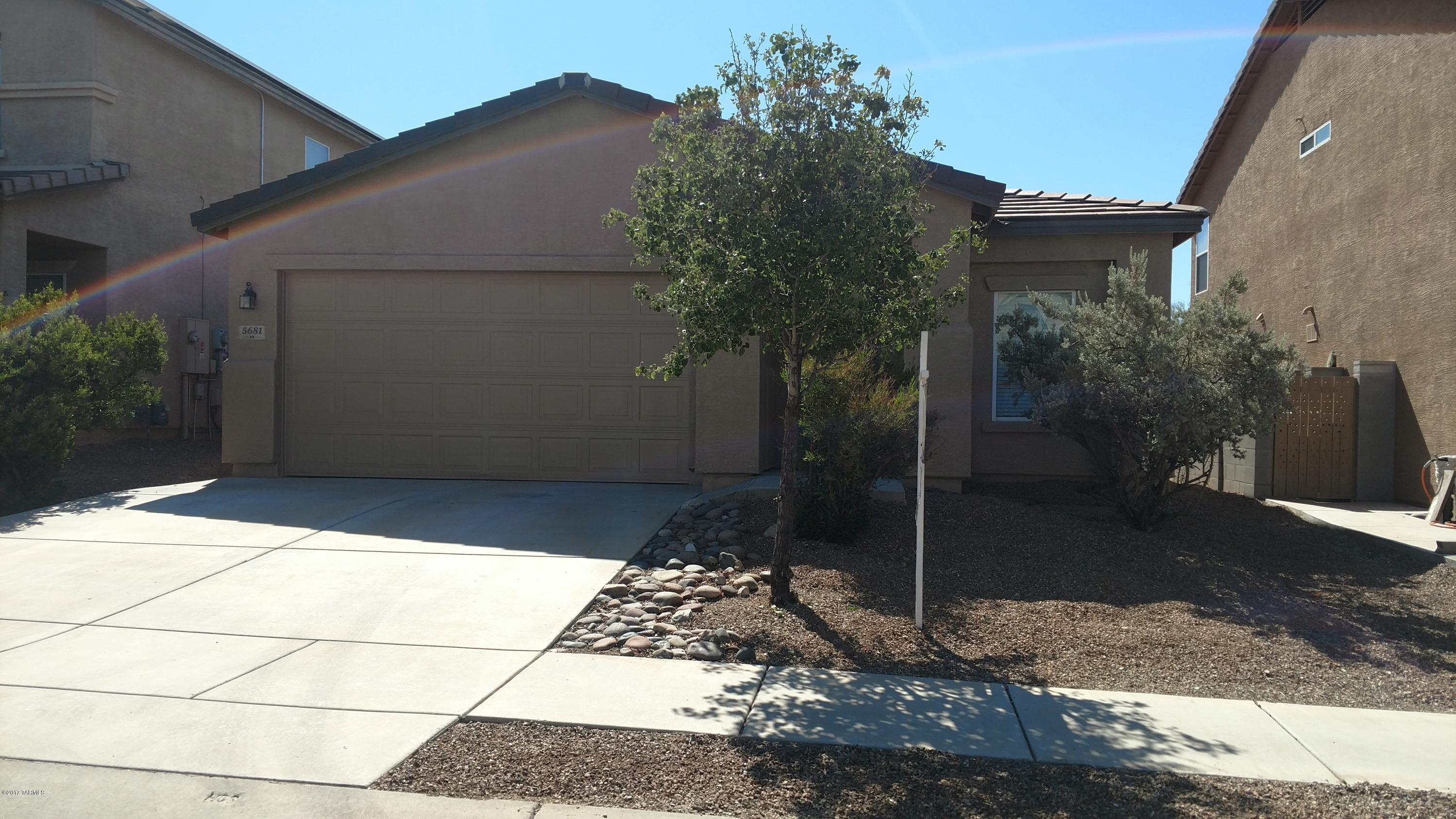 Recently updated four bedroom two bath home in desirable Northwest Tucsons Hartman Vista Community. Features a bright open floor plan to include newer carpet throughout with ceramic tiled in eat in kitchen and newly tiled showers. NEW dishwasher, stove/oven, doors, and window coverings, with custom paint inside and out. This home has gorgeous mountain views with privately walled back yard and no rear neighbors. Boasts a two car garage, front and back yard low care desert landscape with plenty of outdoor space.