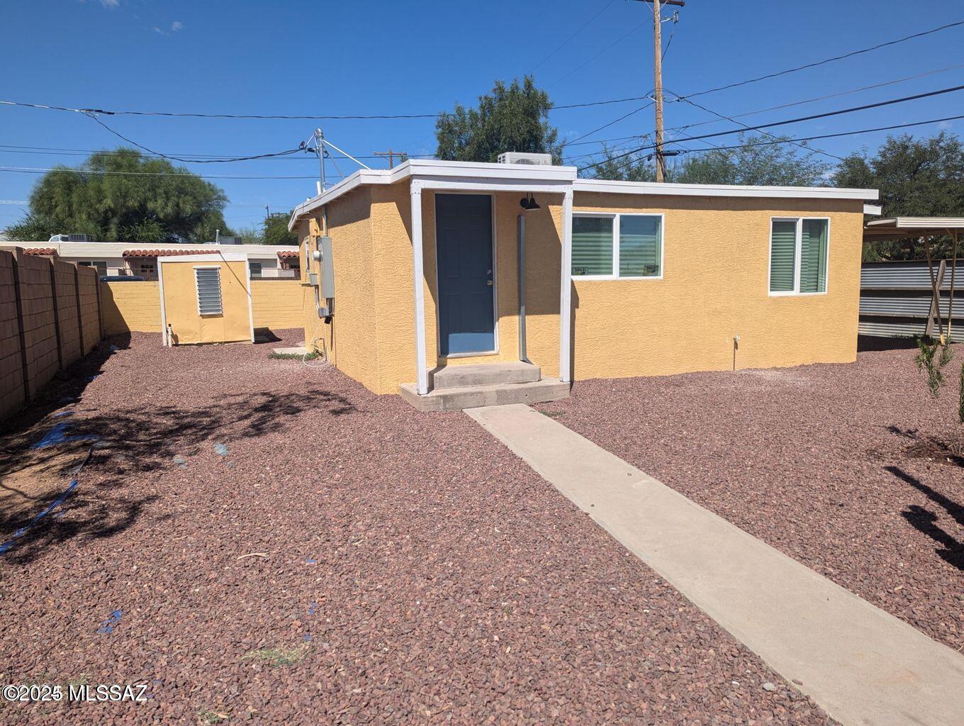 This delightful updated 2-bedroom, 1-bath is located on a side street off Grant Rd. Conveniently located near the University of Arizona, UMC, & Downtown Tucson. Recently upgraded, it features a new 
stove & refrigerator. The zoned mini-split system provides cooling & heating. There is new electrical work with permits. Dual-pane windows, laminate flooring, white cabinets & butcher block counters.
Low-care gravel landscaping with trees. Carport & two (2) storage sheds, one has washer/dryer hook-ups. Popular Central area, this property offers both tranquility & accessibility. Exciting future
developments are planned for the main section of Grant Rd, including widening & beautification. Stucco repair in progress. Don't miss the chance to own this charming, updated cottage, prime location.