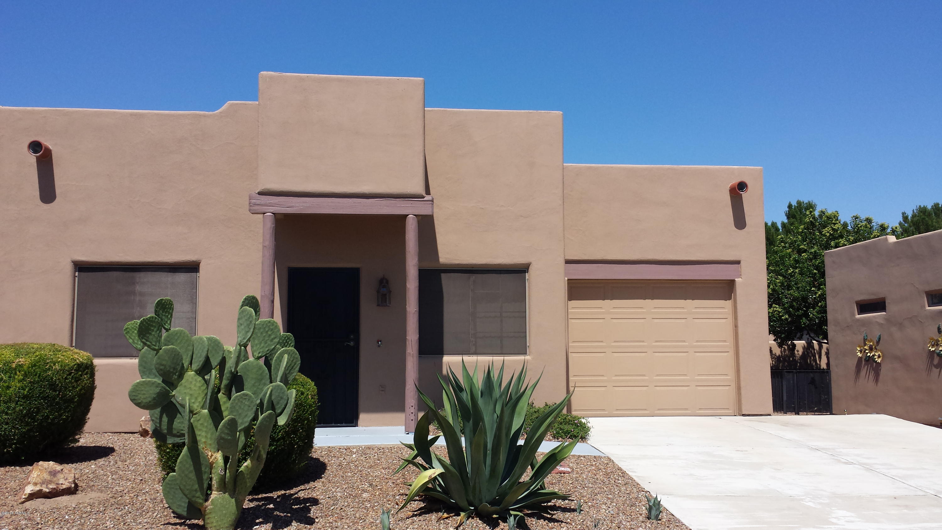 Move in ready! Make this charming townhome your home or vacation home. End unit. Approx 864 sq ft with wonderful, spacious layout. 2 BR, 2BA. Tile throughout most of home. Carpet in bedrooms. Spacious kitchen with lovely dining area. Home has been wonderfully maintained. Roof recoated 2013, 75% of exterior stucco & painted April 2014 & much more! Walk to rec center, pool, & walking path. Dog park in development. Truly a must see home.