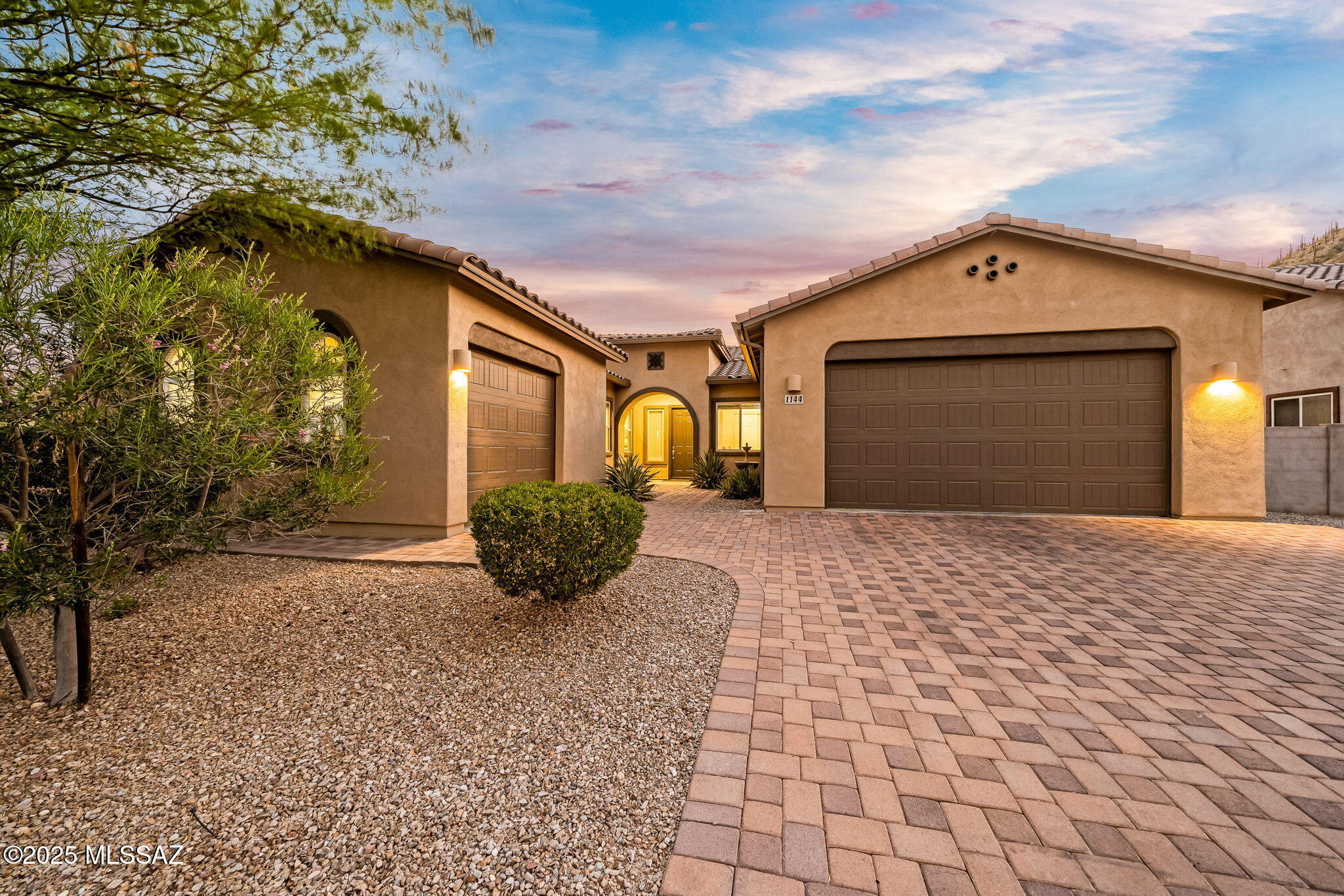 Tucked inside a gated community near Tucson's desirable Starr Pass, this beautifully maintained one-owner home is minutes from downtown, shopping, and freeway access. With 4 bedrooms, 3 bathrooms, and tasteful updates, it also features a bonus room ideal for an office, gym, or media space. The 3-car garage is split into a 2-car and 1-car bay, with the single bay featuring a mini-split AC—perfect for a workshop or home gym. Enjoy mountain views from the front and backyard, a sparkling pool, lush landscaping, paver driveway, and a retractable awning for shaded outdoor living. Lovingly cared for and move-in ready, this home offers comfort, flexibility, and location. Schedule your private tour today!