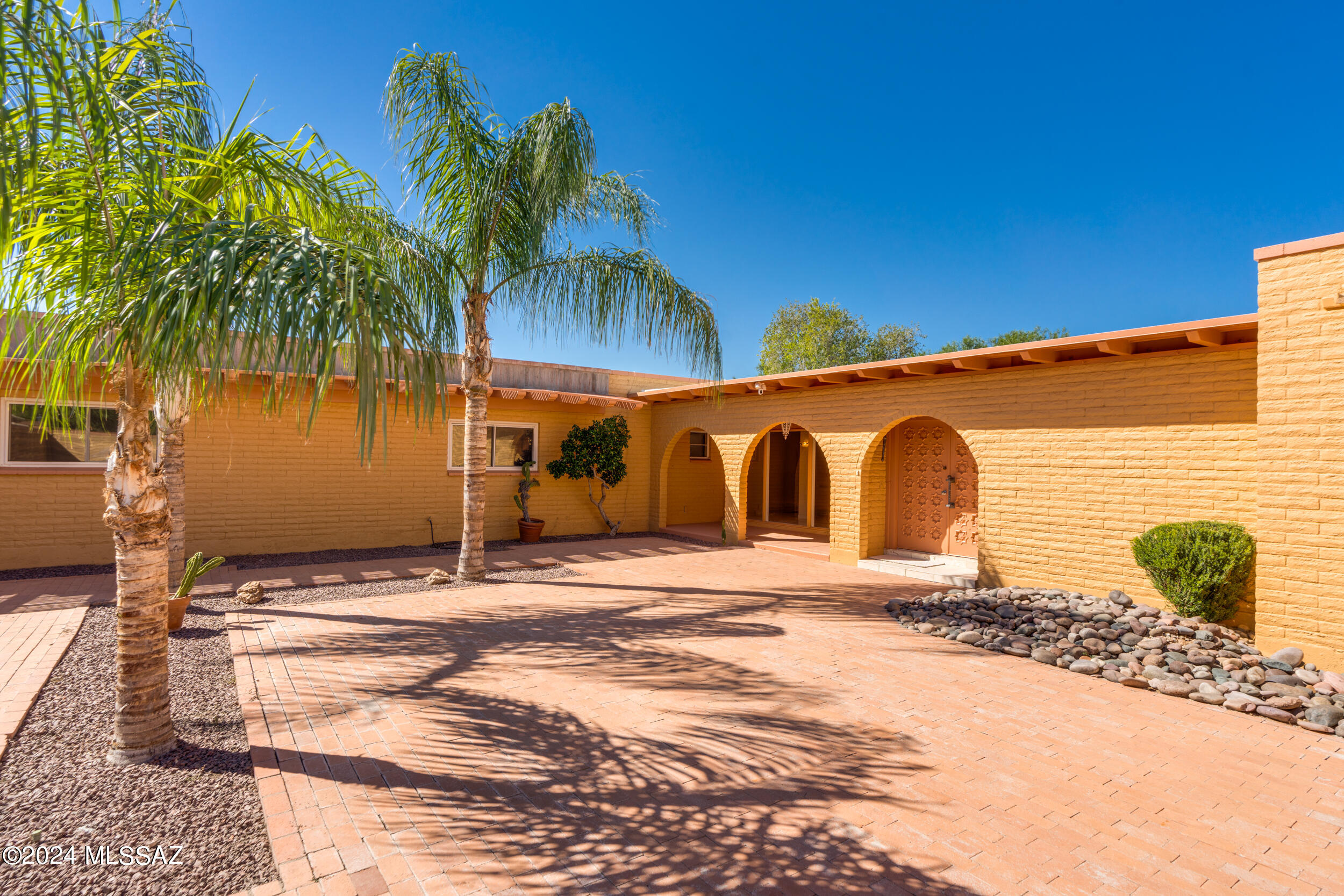 Classic sprawling (4752 sqft) Southwestern home set on 1.28ac lot with lots of privacy. Three main bedrooms split from primary, 5th Bdrm set apart could be used as office, studio, etc & 6th bdrm is a ''nanny's qtrs'' set off from the main house w/private door includes a Bdrm, full bath, walk-in storage & private entrance. North & South facing glass windows allows lovely natural light into main living/dining area. Galley kitchen w/SS appliances, wolf gas range, large walk-in pantry. Loads of storage throughout home. Massive built in island in great room area. Large family/rec room w/pool table. Complete pool renovation 9/23 w/Mtn view. Water heaters replaced Aug24. Roof recoated 7/24. Security cameras & fire sprinklers. Could be great for indoor/outdoor entertaining. NO HOA.