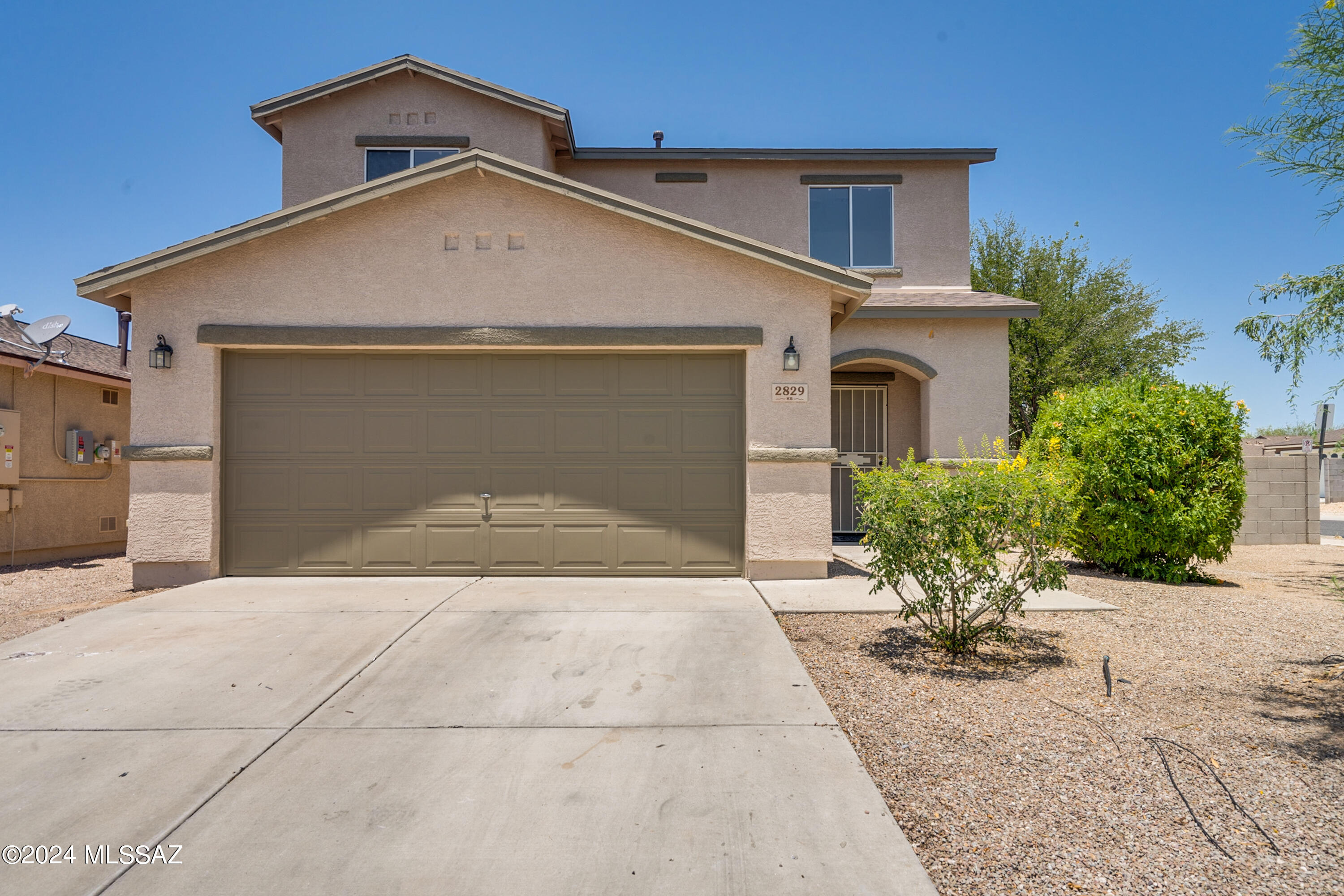 Welcome to your retreat in the heart of the South side of Tucson! This lovely two-story home boasts 3 bedrooms, 2 full bathrooms, and one half bath, and loft upstairs! Providing ample space for comfortable living. Updated flooring on the main level. Entire roof reshingled in Nov. 2023. Updated bathroom finishes and touches throughout.  Step inside to discover a spacious kitchen with farmhouse inspiration, perfect for culinary adventures and gathering with loved ones. With a two-car garage and close proximity to The Bridges, Raytheon, and DMAFB. This home offers both functionality and charm. Don't miss the opportunity to make this lovely home your own - schedule your showing today!