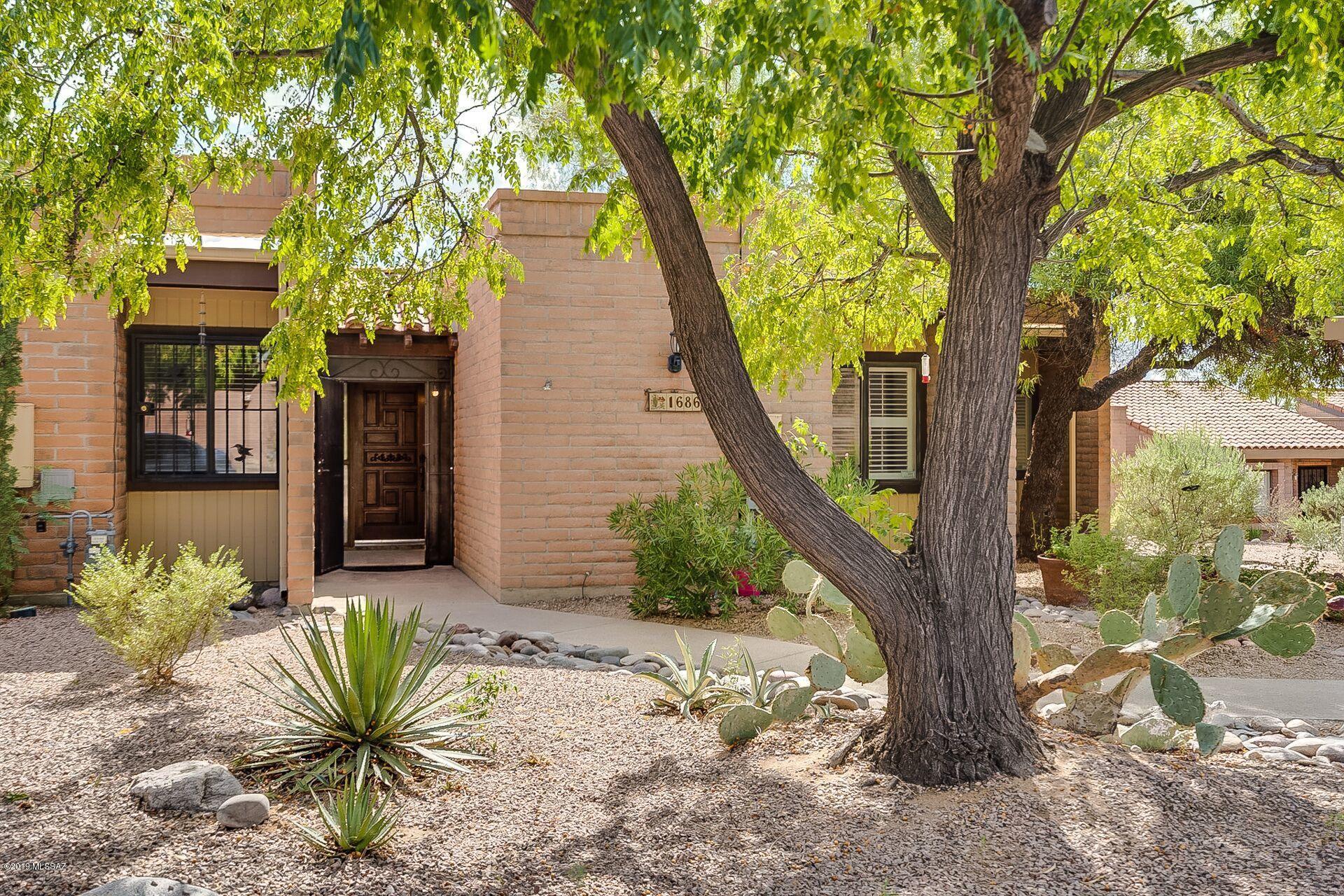 Updated and move-in ready End Unit in La Cholla Hills Over 55 community. 2BR, 2 Bath Split Plan allows privacy for you and your guests! Inspected and repaired including Roof being serviced Coated & Warranted. New in 2019: Dishwasher, Disposal, all Counters, Water Softener, Hall Bath Toilet,Ceiling Fan and more. Interior all Freshly Painted, NO 'popcorn' ceilings. Newer Washer and Dryer. Dual Pane Windows. Desirable End Unit lot with AZ Rm opening to charming Common Area landscape. HOA includes 2 Pools, Spa, Tennis, Pickleball, Shuffleboard, Bocce Ball. Club House w/ Kitchen & Library & Ping Pong Table! Wonderful Clubhouse Events. HOA includes front yard maintenance & Trash Pickup.  AHS Shield Plus Home Warranty!