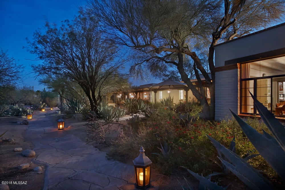 This gorgeous 1948 Joesler built Mud Adobe home w/separate 1022sf casita, is perfect for an artist, a sole practitioner, or RBO rental. Live in Sonoran Desert splendor on your own lush private 2.1 acre estate in a resort like setting within walking distance to historic Casas Adobes Shopping Center, amazing restaurants, fitness facilities & Whole Foods grocery. Enjoy the flora, fauna & mountain vistas from the extended front patio. The beautiful interior craftsmanship details are typical of a Joesler, w/every window capturing what makes the outdoors in Tucson special. Master suite has a spacious walk-in closet & a master bathroom w/extensive artistic glass & tile work. The kitchen is a home chef's delight w/SubZero fridge, professional stove & large walk-in pantry. Must see to experience!