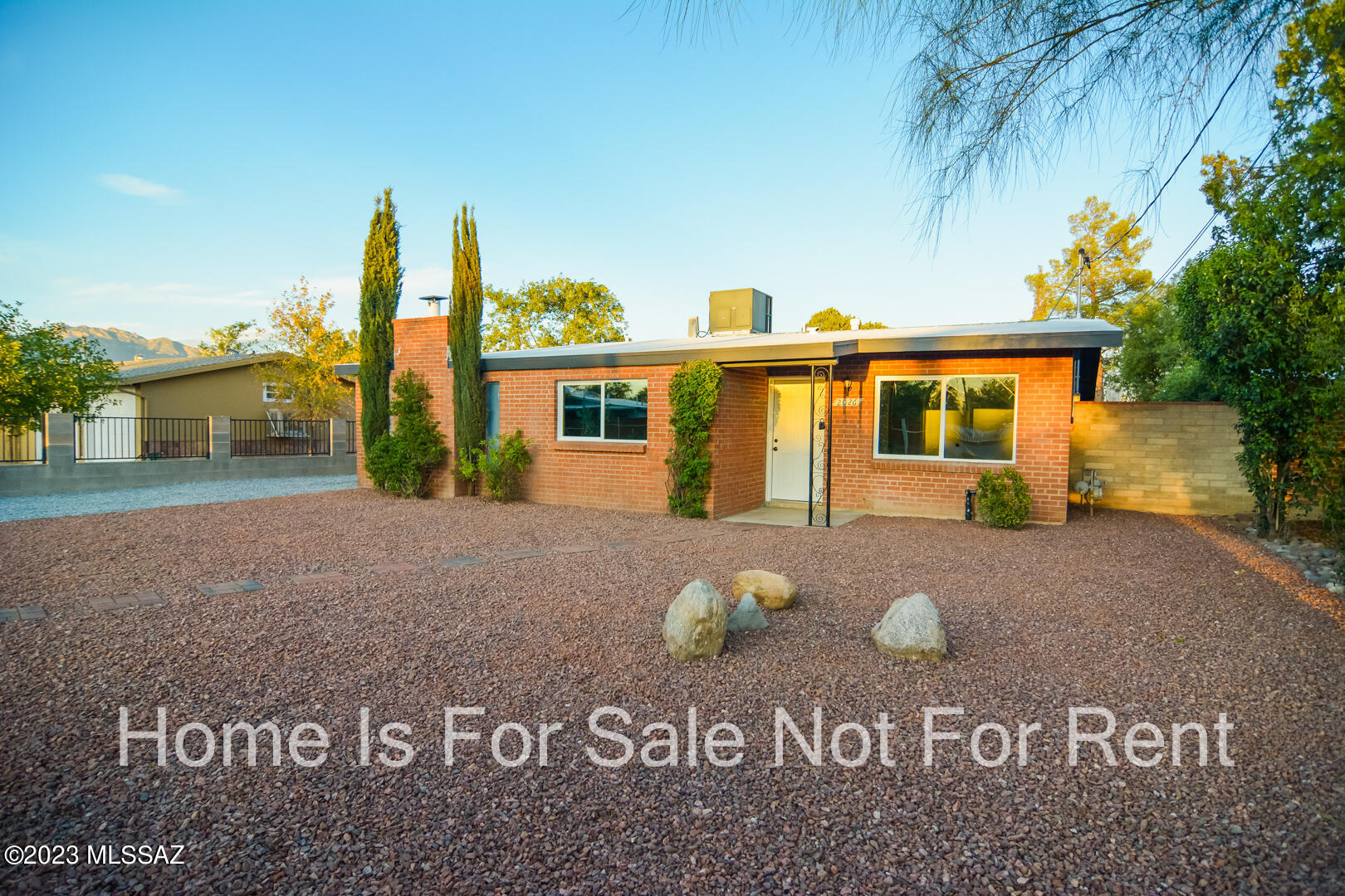 Beautifully remodeled Ranch style home. Located in a convenient Central Tucson location. Charming brick construction. Rich wood look LVP flooring. Updated kitchen with stainless steel appliances. New custom interior and exterior paint. Rustic fireplace. Fenced back yard. Upgraded door hardware and light fixtures.  Mature vegetation. Large storage shed/workshop. Dual pane windows. This home shows beautifully.