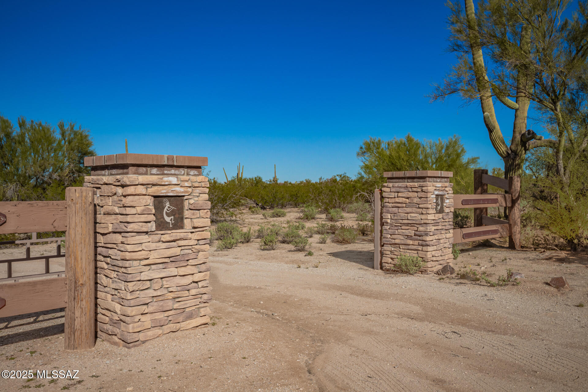 A private half-mile easement leads to the gated entrance of Kokopelli Estates—an exclusive end-of-the-road retreat bordering BLM land. This secluded oasis offers exceptional privacy and tranquility, set against the stunning backdrop of the mature Sonoran Desert. Enjoy abundant wildlife, sweeping panoramic views, and unforgettable sunsets. Underground utilities in place with established road and water well agreements. Four parcels available, each approximately 9.5 acres. A truly rare offering—seeing is believing!