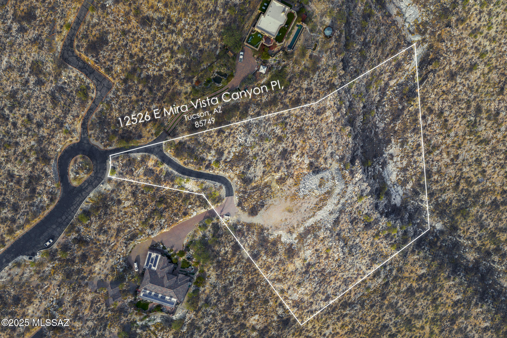 Exclusive 3.3-acre lot in the gated Mira Vista Estates community is positioned with a coveted North/South orientation & offers captivating sunrise & sunset views over the city-scape & surrounding mountains. Easy access via a fully paved road, this private & tranquil lot is situated at the cul-de-sac's end & is adjacent to a small canyon. A prepared house pad provides a level build site, ALL essential utilities saving you valuable time, money, & effort. This is your unique opportunity to craft your dream home in an exclusive Tucson community in the Tanque Verde School district. Contact me today for more details or to schedule a showing.