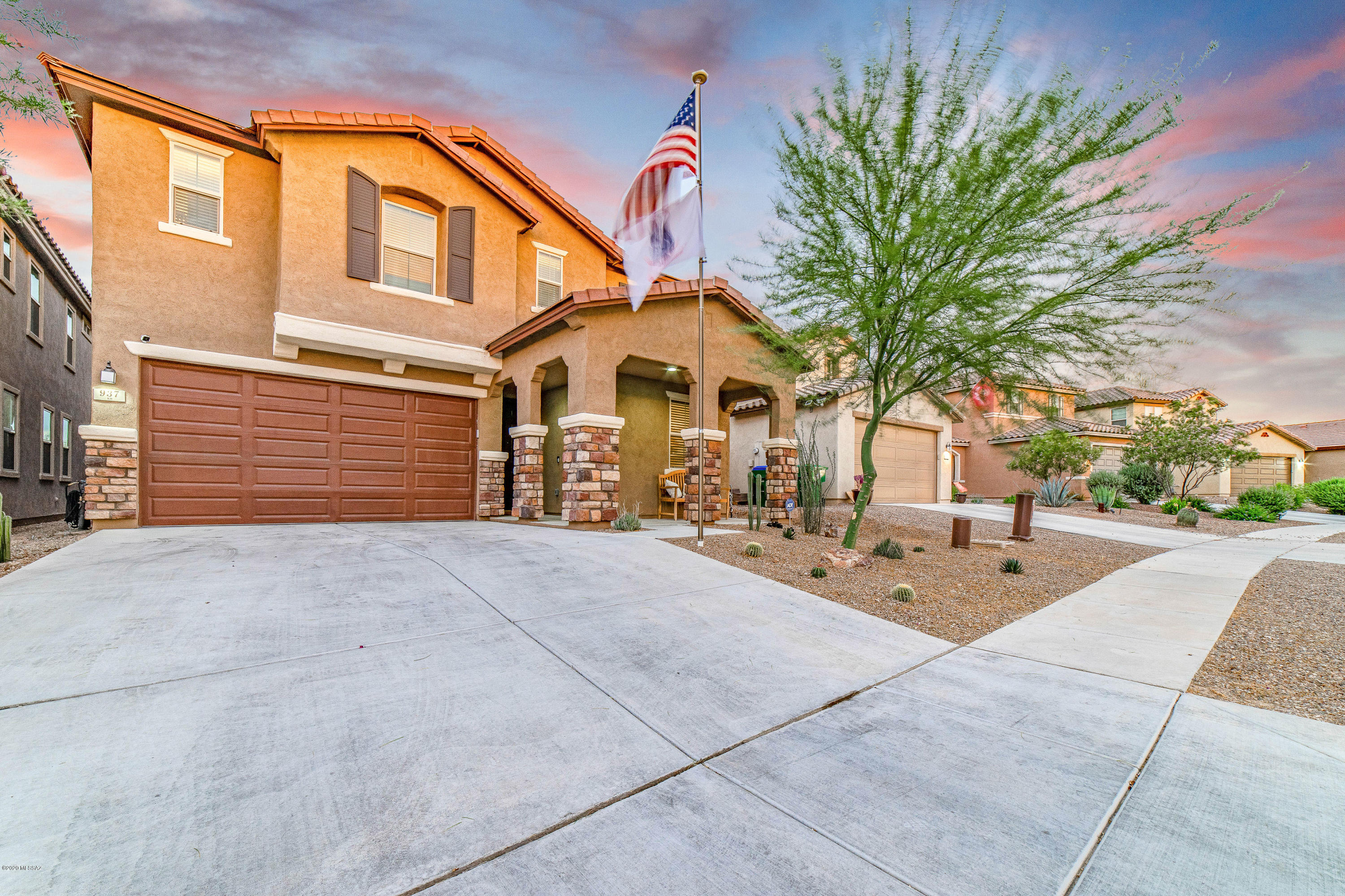 This stunning 4 bedroom 2.5 bath home with 2836 square feet is a refuge inside Rancho Sahuarita.  The home is upgraded in many respects with an integrated sound system, fully landscaped backyard,  an epoxy coated garage floor, upgraded stainless steel appliances, soft water loop with soft water system and smart irrigation system. Lots of upstairs and down stairs storage allows you to keep daily items hidden away yet accessible.  This property shows like a model and will impress even your most discriminating buyers.   A split upstairs floor plan allows privacy in the master suite  and each bedroom has its own full walk in closet.  The home also borders a common area in the back so you have plenty of space between you and your backyard neighbors.  Enjoy the best Rancho Sahuarita has to offer