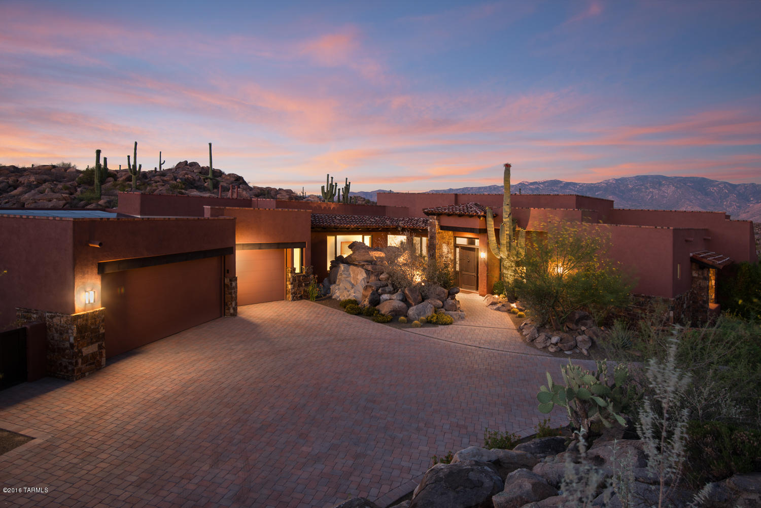 Beautiful Southwestern/contemporary home on spectacular home site in the guard gated Stone Canyon Club. The perfect retreat nestled in the Tortolita Mountains on private lot with unobstructed majestic Catalina views with numerous saguaros! Inviting brick paved driveway approaching entry with easy turn around for vehicles. Thoughtfully designed with simplicity in mind. A 2527 sq.ft. home with everything you need and more. Split floor plan with large master suite, two guestrooms, great room with built in Alder cabinets, gourmet kitchen with Caesar Stone countertops and Viking appliances. Kitchen and great room overlooking large covered patio and incomparable views. Also easy access to viewing deck with Jacuzzi hot tub for stargazing or just watching the soaring birds!