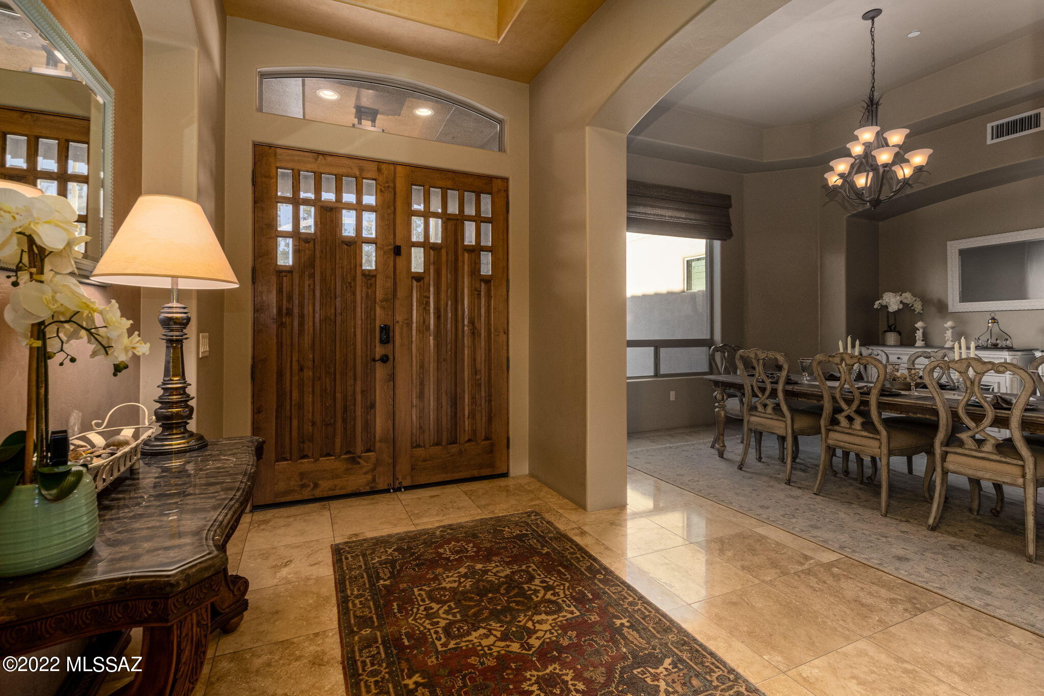 This fully furnished 4 bed, 4.5 bath, 4 car garage home located in the highly desirable Dos Lagos at Dove Mountain subdivision is a buyers dream. Indulge in complete luxury with stunning upgrades inside and out. Greets you with high ceilings in the entryway, formal dining room and spacious living room. These lead to a large open kitchen with large pantry, double ovens, commercial size refrigerator, and dining space. Step outside into your own private oasis featuring a cozy gas fireplace, mounted TV, and experience ultimate comfort in your Tropitone outdoor furniture. Completely shaded with retractable awning and misting system for those hot days. Fully remodeled pool, 2 spas, and outdoor kitchen with all new appliances, weather proof TV, and sound system. The attached 3-car garage contains plenty of storage along with a detached garage that has a climate controlled/dust-free storage room and state of the art golfing simulator. This home is truly a one of a kind property! (See additional list of additional upgrades in documents).