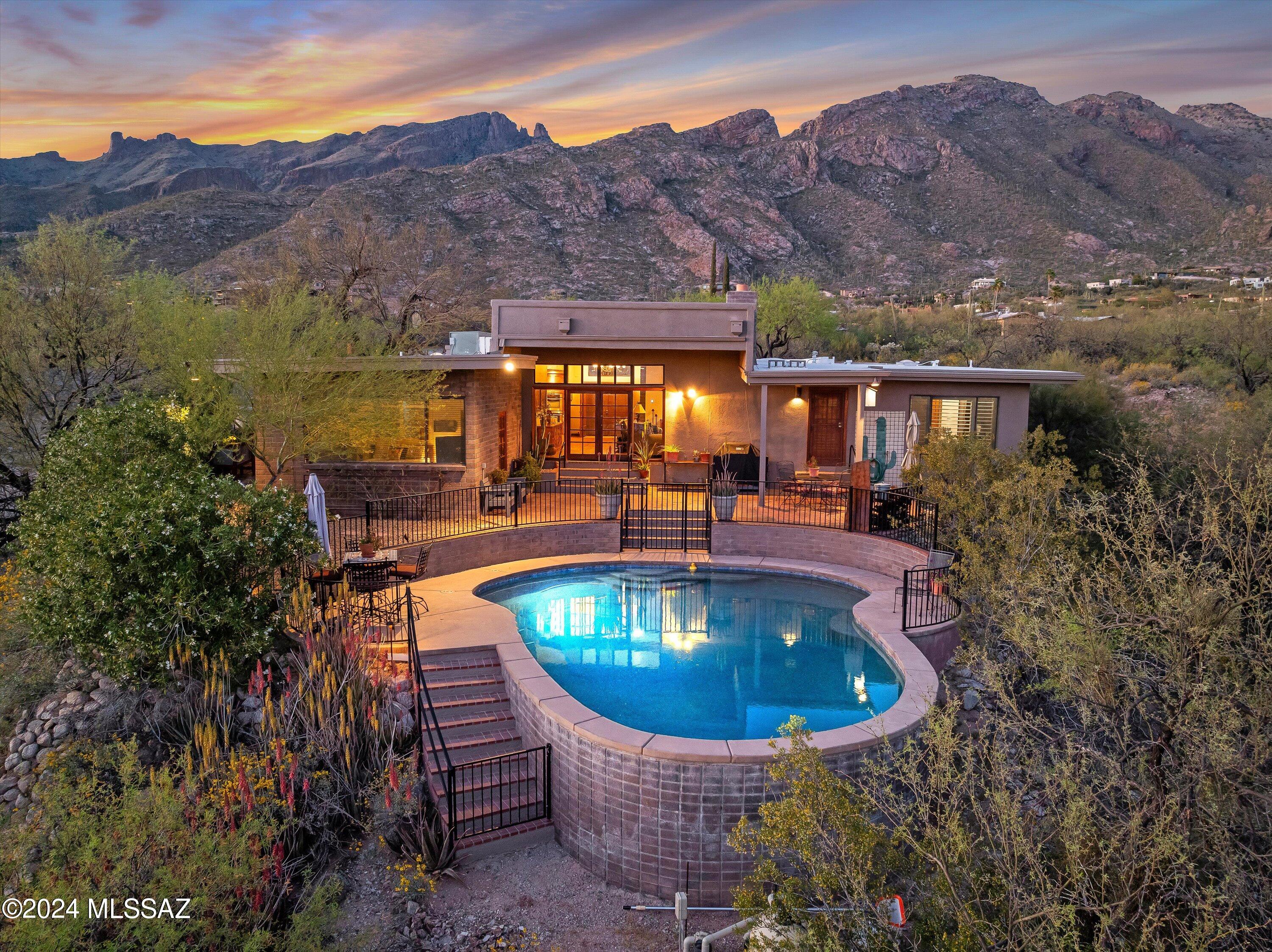 !!!! BREATHTAKING VIEWS !!!!
Welcome to this 3bd/2ba split floor plan open concept home, located in the sought after Coronado Hills Estates. 
Just shy of an acre, providing lots of privacy, this home is full of the quintessential Tucson charm.  Floating brick floors, beautiful open kitchen, granite counters, island gas cooktop, stainless steel appliances.  Custom gas fireplace, formal dining with private patio!  Large master suite, includes; wood floors, plantation shutters, sitting area and updated ensuite.  Master closet also gives private access to the third car garage. 
This desert oasis features etched block construction, high ceilings, large wall of windows for both city and mountain views. Resort style backyard includes large patio, negative edge pool and an outside shower for your convenience.
Come see this perfect home!