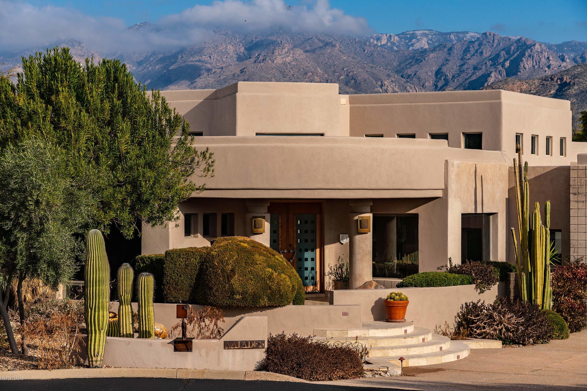 Superbly built 3BD 4BA soft contemporary, fully furnished retreat with an oversize lot tucked inside the tranquil grounds of the world renowned Canyon Ranch Wellness Resort, Immerse yourself in a year round privileged Life style with access to first class resort amenities. State of the art Spa, round the clock fitness classes, outdoor activities, tennis, pools and wellness treatments all at your figure tip. Lori Caroll Digns touch are in full evidence in this architectural gem. Edged glass doors greets you into a majestic high ceiling great room with floor to ceiling panoramic window inviting breath taking mountain views. Great room boasts a built- in entertainment center, travertine tiles, dining nook. Flawlessly opens into a chef's kitchen with a large granite top counters, stainless steel appliances. Separate dining room with a view of cactus and Sonoran landscape, Separate cozy living room off of the great room.. two gentle steps takes you to a spacious master suite with an intimate fire place, floor to ceiling view of the mountains,. Spacious master suite bathroom. Plus two additional master bathrooms in the other two bedrooms. Enjoy relaxing in the backyard along the waterfalls and the spa, Bbq and outdoor kitchen makes for great outdoor entertaining.