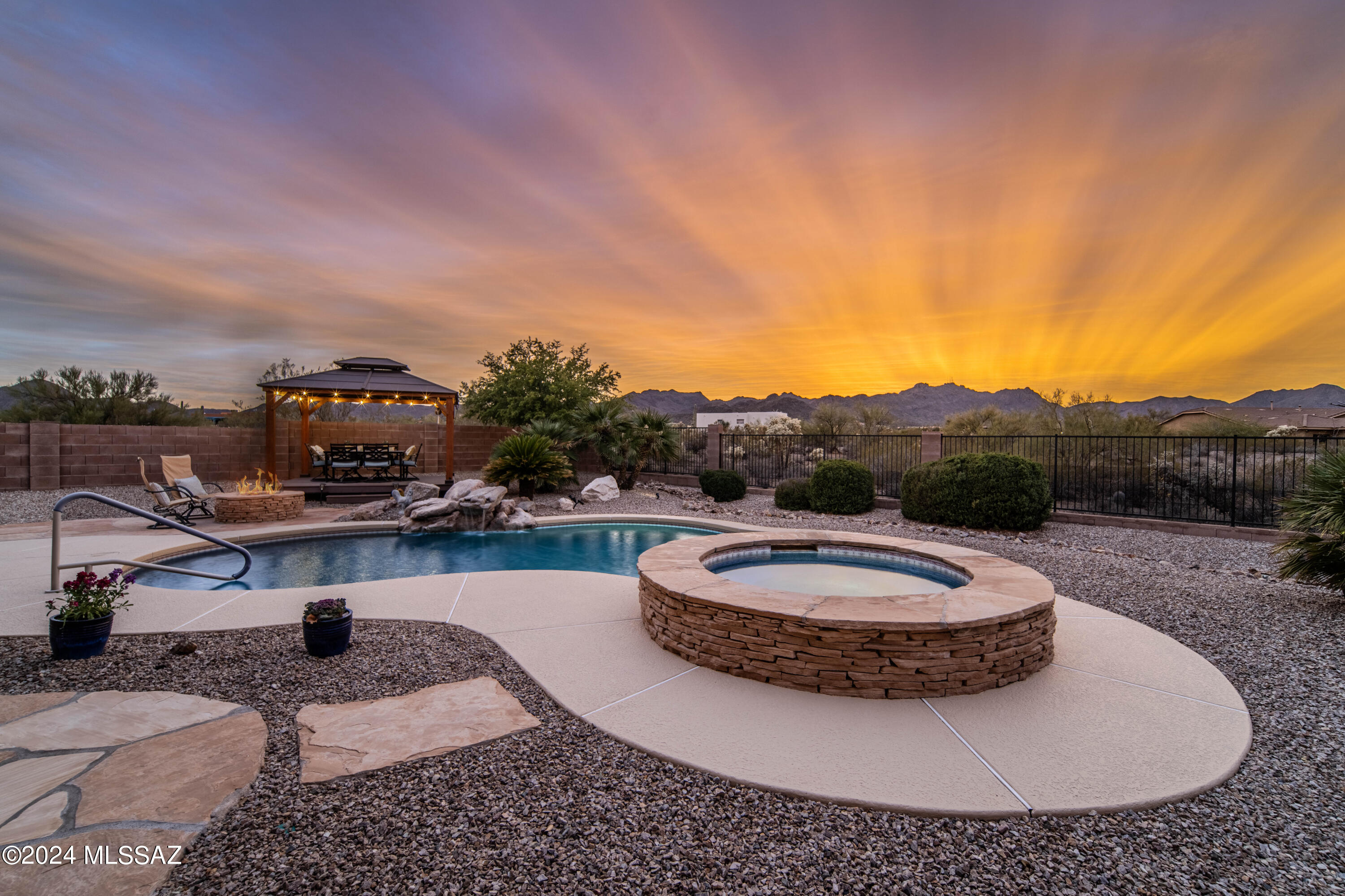 Introducing this stunning 5 bedroom, 3 bath home situated on almost an acre of land in a desirable gated community. This one-story gem boasts a spacious floor plan, offering just under 3000 sqft of living space.

The home features both a living room  and family area with a fireplace, as well as an updated kitchen, providing ample space for relaxation and gatherings. 

The large master suite is a true retreat, complete with a soaking tub, a huge closet, and sliding doors that open up to the backyard. Imagine waking up every morning to the beautiful view and enjoying the privacy and tranquility of your own oasis. This property also offers an extended 3 car garage, providing plenty of space for parking and additional storage. The long driveway ensures that there is ample room for your guests when they come to visit.

Step outside to the backyard and discover a covered patio, perfect for outdoor dining and entertainment.  There's even a built-in grill and beautiful fire pit area allowing you to host memorable barbecues with friends and family. The gazebo provides a shaded space for a large table and chairs, creating a perfect setting for entertaining. This backyard is highlighted by a gorgeous pool and spa. Jump in and enjoy a refreshing swim, or simply lounge in a hot bubbling spa enjoying the breathtaking sunset views. With no close neighbors, you'll have the ultimate privacy to unwind and enjoy your surroundings.

This home has been meticulously maintained and comes with new AC units, ensuring optimal comfort throughout the year. It also offers plenty of storage space, allowing you to keep your belongings organized and clutter-free.

Don't miss out on the opportunity to own this incredible property. Schedule a viewing today and experience the epitome of luxurious living in a serene and gated community.
-