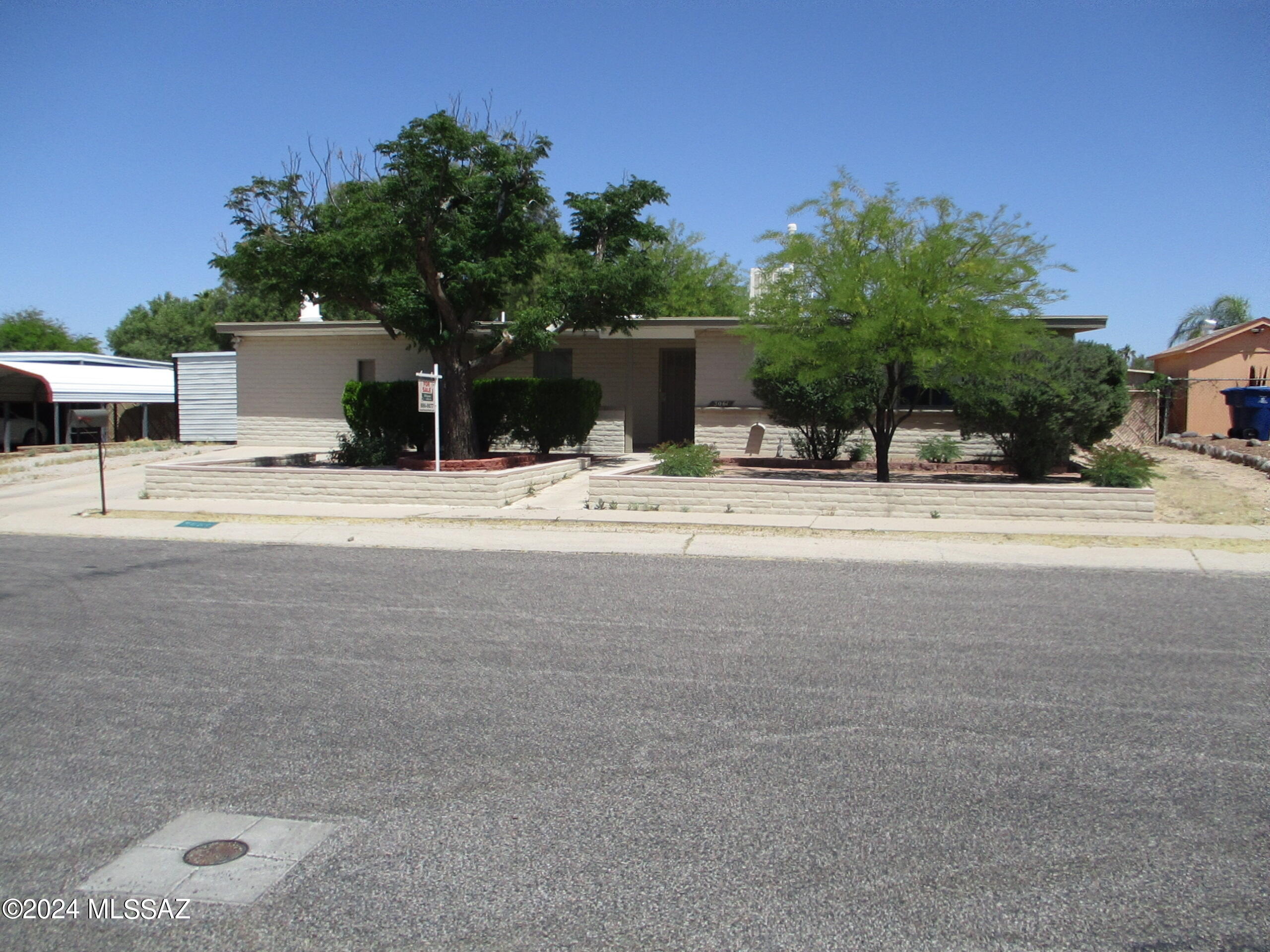 'Step into this freshly painted inside & out 4 bedroom, 2 bath home.  No HOA.  Bright & inviting living room & formal dining area.  New kitchen cabinets & counters.  2 refrigerators for all your goodies.  Off the kitchen is a separate family room with fireplace, computer nook, built-in bookcase, huge storage closet & the 4th bedroom with it's own entrance.  Could be Mother's or guest quarters.  Enjoy your coffee & sunrise on the front porch  or sunsets on the back patio.  Low maintenance landscaping, both front & back.  2 storage sheds to store your tools.  Convenient to nearby shopping, restaurants & bus line.  All of this plus a conventional pool.  Come see .
  Blinds stay, curtains do not. Seller will consider seller concessions toward installing Central Air Conditioning.