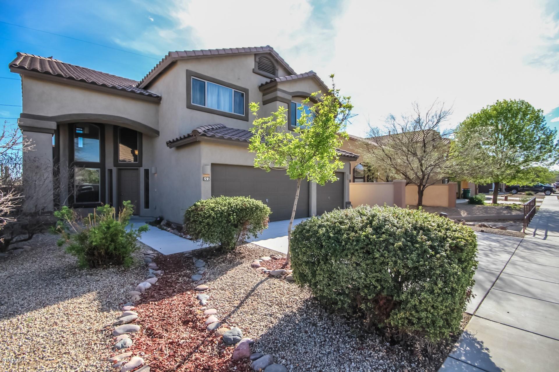 OPEN SATURDAY 10 - 12:00 !!  HURRY OVER!  SAHUARITA AT ITS FINEST. Spectacular 2 story home with NO NEIGHBORS BEHIND YOU! Privacy is priceless. 4 bedrooms & 3 bath PLUS a 3 car garage & bonus room. Brand new carpeting throughout home. Fabulous floor plan with room for everyone. Grand entrance with cathedral ceilings and a grand staircase that would make even Scarlett happy! Open and Bright and close to Pima Mine Rd for convenience - easy access to I-10, Raytheon, Davis Monthan and downtown. Plus super close to all the fun amenities of Sahuarita INCLUDING parks, lakes, pools and play toys! This perfect house is just waiting for you!