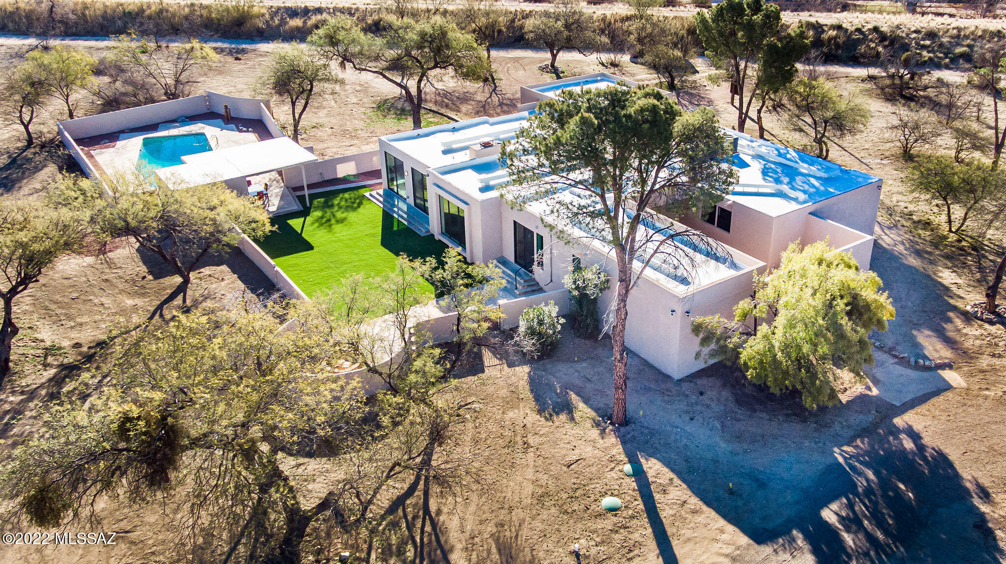 Serene 3.3-acre property boasting Catalina and Rincon Mountain views! Located on a private side street. Fully renovated 4 bedroom/4 bathroom home with a modern and traditional flair – Stunning walls of windows allowing for gorgeous mountain views. Spectacular floor plan for your family and an entertainer's dream! Beautiful Kitchen consists of a 36'' Thor gas range with Custom built in Hood, Hand picked granite slabs with a 9' custom island and tons of storage. Custom cabinetry with soft close drawers. Undermount single large bowl kitchen sink with spray faucet,
Stainless steel built in roll out drawer microwave, Bosch dishwasher. Backyard oasis w/ artificial grass, gorgeous replastered pool, a Ramada with TV hookup,  BBQ area, and a Firepit with Bench seating.  The master bedroom is 22x and has a sliding glass door to the rear yard. Gorgeous primary bedroom retreat with a sitting area, sliding glass doors to the back yard, large walk in closet and a luxurious bathroom with double vanity sinks, designer mirrors, an oversized shower and a free-standing tub. Front brick paver courtyard with private sitting area.  All of the bedrooms are extremely large. Great sized laundry room with lots of cabinetry, sink and washer/dryer.
Oversized 2.5 car garage with storage rooms and workshop area.Recessed LED lighting in all rooms,modern interior doors with upgraded hardware, New dual pane low E windows, Upgraded electrical, new plumbing, New Hvac system, new water heater, New septic. Private well  Newly double coated roof.  NO HOA, plenty of room for RV parking, close to Parks, hiking trails, Resorts, Golf Courses, restaurants and shopping. Award winning Schools.
