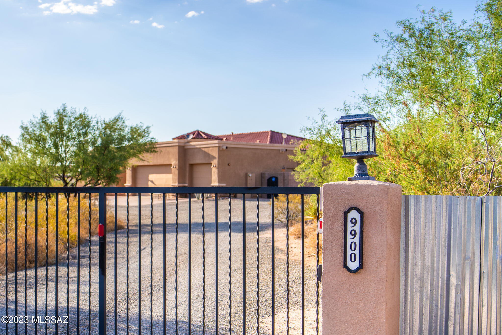 Are you looking for a place away from it all with space to spread out plus a HUGE detached garage/workshop plus a meticulously maintained home? Your search is over! 2018 custom-built AF Sterling home has it all. This diamond in the rough has a desirable open floor plan boasting high end finishes throughout. Soaring 12' ceilings in the Great Room with oversized windows that take in  captivating Catalina Mountain views. The kitchen is a cook's delight with an enormous granite island that will have friends & family gathering around while you prepare meals on the high-end Electrolux stainless appliances including induction cook top. Abundant natural hickory cabinets with soft close & pull out features. The primary bedroom also has beautiful Mtn views and has access to the deep covered patio. Dreamy spa-like en-suite bath with dual granite top vanities, dual walk-in closets, free-standing tub to soak your cares away and a large, tiled shower.  Split bedroom plan with Jack & Jill bath plus a wonderful den off the Great Room perfect for a home office. Half bath with pedestal sink off the kitchen.  Fenced, pet friendly and low maintenance backyard with artificial turf and lovely covered 70' long patio where you can relax and take in the views or gaze at the stars. Double gate leads to the amazing, detached garage that is a mechanic's or car lover's dream! The 30' x 40' garage has space for several vehicles plus a workbench, built-in cabinets and a compressor. Adjacent 18' x 40' RV covered space with electric too! Shed also conveys. The deep property provides plenty of room to add a pool, guest house or space to bring your horses!  Smart home with Electronic gate, security system and Nest dual thermostat system. Shared well with Superstition Coop, $50/month and tested monthly. Transferable Select Home Warranty through October 2024. Northwest Exterminating Termite Warranty. Vail school district.  Make this beautiful and very special home your home sweet home today!