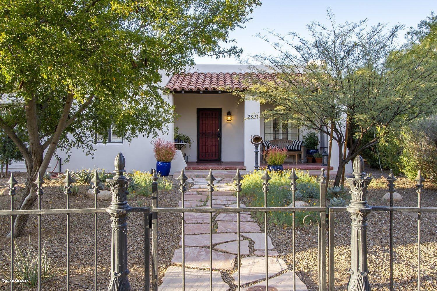 Renovated Historic Family Compound in Sam Hughes,  Main House has 4 brms/3 baths including restored in-law bed and bath, formal living & dining, den, enclosed AZ Room & new laundry. Original hardwood floors, beamed ceiling & leaded glass windows, arched doorways, 2 fireplaces. New air conditioning, water heaters, and electrical. 2 remodeled casitas w/new kitchens and baths, separate entrance/parking - use for guests, office/studio or extra income. Historical wrought iron fence & new 7' stucco walls. New landscaping w/irrigation & new workshop in central courtyard plus 2nd private rear patio. Unfinished basement & off-street parking for 5 cars. Best walkable neighborhood in Tucson - bike path to UofA, Himmel Park , Rincon Market & great restaurants. Low historic property taxes. Please see 
virtual tour
list of improvements
and bring us an offer!