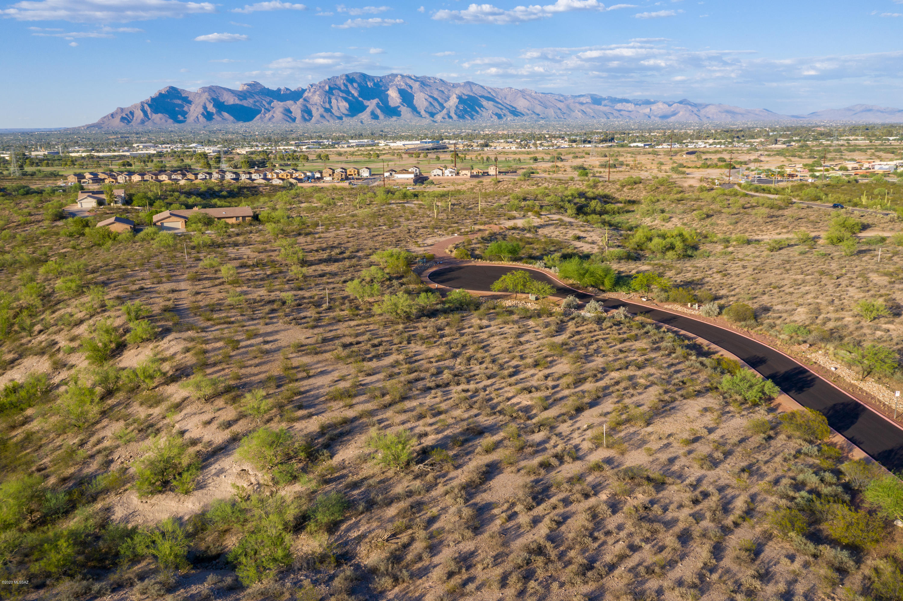 Located within the Las Nubes subdivision this extensive 1.21 acre lot has beautiful Tucson mountain views and lush desert landscaping. It is located near the gated entrance and next to large Arroyo. 1 of 14 custom home lots surrounded by gorgeous mountain and desert views you can't resist. This community includes freshly paved streets and walking trails. Don't miss out on building your future home in this splendid subdivision! This is 1 of 14 available lots in the Las Nubes Subdivision. Please see for the 14 individual lot Parcels and MLS Numbers: Master Parcel: 103-19-2280 - MLS #: 22019050 LOT 1  Parcel: 103-19-2140 - MLS #: 22019798 LOT 2 Parcel: 103-19-2150 - MLS #: 22019799 LOT 3 Parcel: 103-19-2160 - MLS #: 22019801 LOT 4 Parcel: 103-19-2170 - MLS #: 22019805 LOT 5 Parcel: 103-19-2180 - MLS #: 22019807 LOT 6 Parcel: 103-19-2190 -MLS #: 22019811 LOT 7 Parcel: 103-19-2200 -MLS #: 22019816 LOT 8 Parcel: 103-19-2210 - MLS #: 2201981 LOT 9 Parcel: 103-19-2220 - MLS #: 2201981 LOT 10 Parcel: 103-19-2230 - MLS #: 22019820 LOT 11 Parcel: 103-19-2240 -MLS #: 22019822 LOT 12 Parcel: 103-19-2250 -MLS #: 22019826  LOT 13 Parcel: 103-19-2260 -MLS #: 22019827 LOT 14 Parcel: 103-19-2270 -MLS #: 22019828