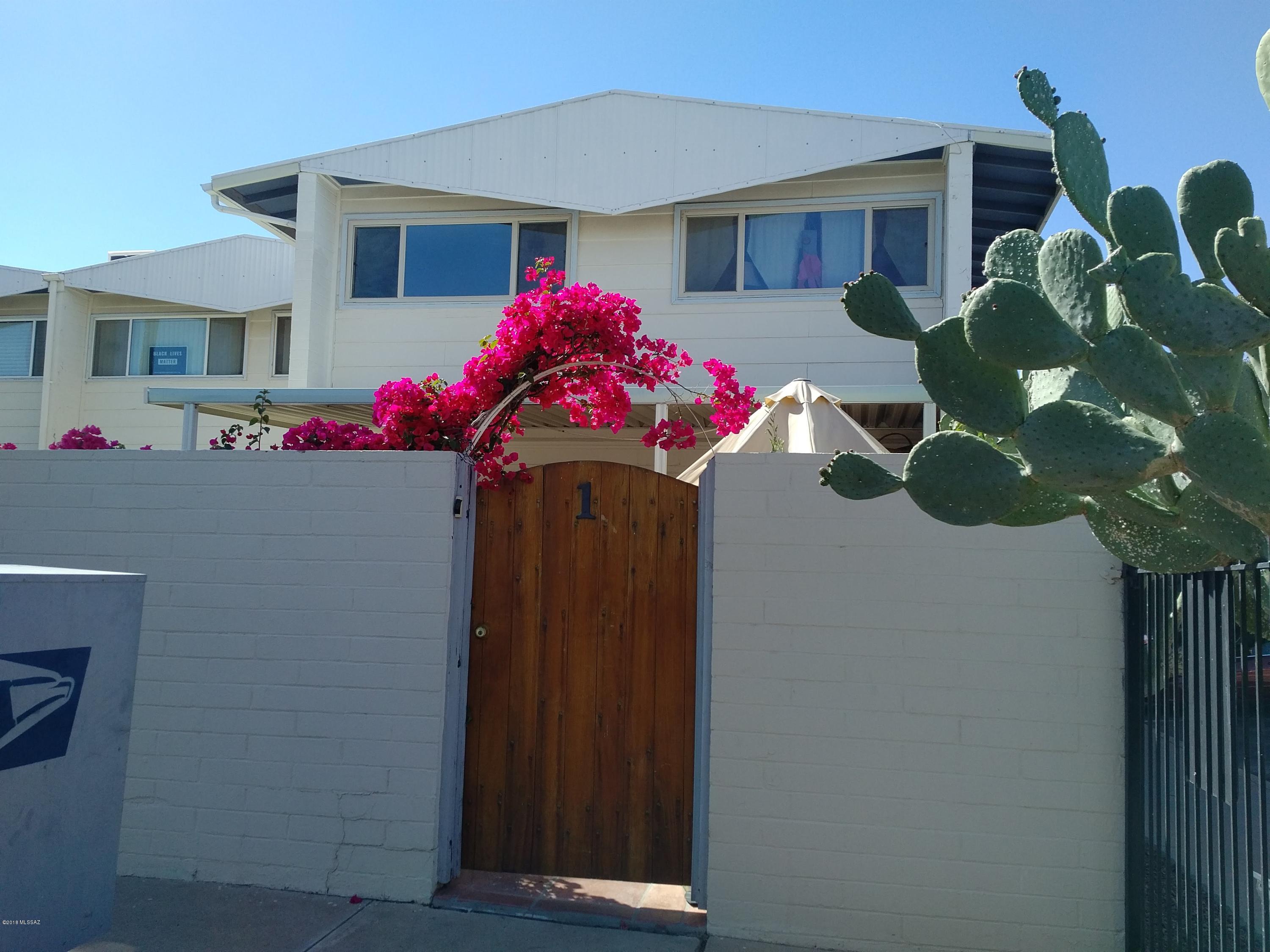 Rare 2 bedroom/1.5 bath stand alone coop in Central Tucson! Central AC gas pack! Remodeled kitchen with all appliances (new stove, new dishwasher, new fridge), granite counter tops, Cherry wood cabinets. Kitchen opens up to the living room with Mexican Satillo floors. Half bath is downstairs and can have washer/dryer or convert to a sink. Wooden stair case. Upstairs bathroom has new lights, new vanity. Upstairs has bamboo floors. Dual pane windows throughout. Popcorn ceilings removed. 12 X 10 Awning in front yard, fans in rooms. You don't want to miss this one!