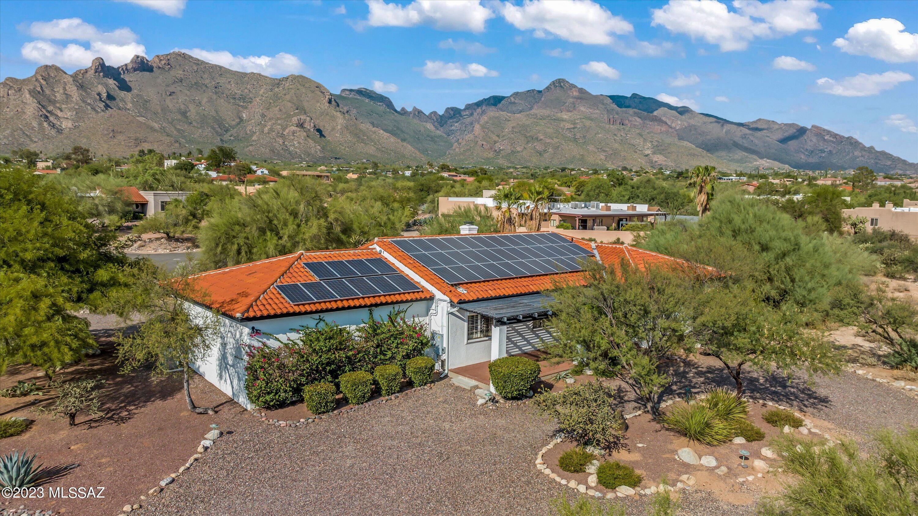 Welcome to a home that effortlessly blends the warmth of Southwestern contemporary design with luxurious modern amenities including paid solar! 
Nestled on a sprawling .88-acre lot, this property presents a rare opportunity to own a piece of paradise in the coveted Westward Look area for the discerning buyer. Wake up to breath-taking awe-inspiring vistas of the Catalina mountains. Beautiful kitchen adorned with granite countertops and top-of-the-line Viking appliances where culinary dreams come true. This 4 Bd 3 Ba has room for a growing family, home office or hobbies. Large garage with storage area & room to work. Pool and yard are perfect for entertaining. Don't miss your chance to own this exceptional piece of Tucson paradise. Schedule a tour today!