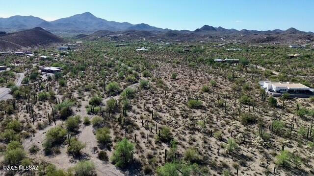 Discover the perfect blend of natural beauty and privacy on this stunning 4.54-acre parcel nestled in Tucson's desirable west side. Surrounded by mountain and city views, this serene site features over 2 acres of designated riparian area and an abundance of towering saguaros. With no HOA or deed restrictions, enjoy the freedom to create your dream home, ranch, or desert retreat.

This unique property offers a true sense of rural living while being just minutes from I-10, downtown Tucson, and convenient shopping and dining options. The lot has been surveyed (March 2024), with cleared access and clearly marked boundaries, making it easy to visualize your future build. Electric and water are available at the lot line; buyer to verify septic and utility connections.