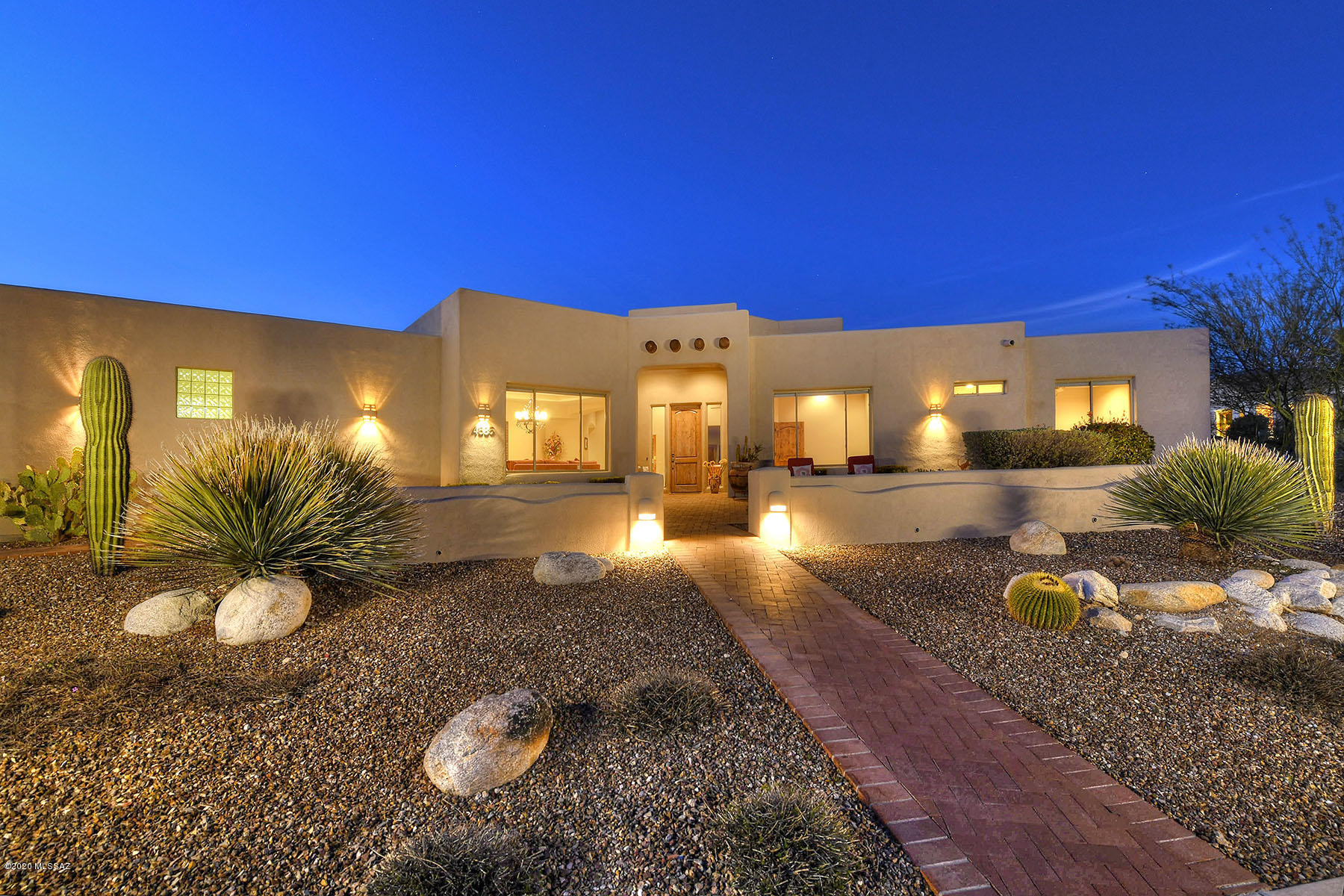 Stunning home located at top of  Sabino Mountain, a gated community nestled in the foothills. Dramatic city & Rincon views from front & expansive views of Catalina mountains from back. 1 story custom home is airy w/ tall ceilings. Contemporary natural materials throughout. Enjoy stone travertine floor, alder wood cabinets & doors & granite countertops in kitchen. Chefs kitchen w/ large island, stainless appliances & dream pantry. Large separate den w/ french doors. Open living room w/ magnificent stacked-stone fireplace. Welcoming Family Room. Patio boasts bee-hive fireplace, sparkling pool & spa & incredible views. Plenty of room for entertaining guests year-round. Perfectly located in Tucson Catalina Foothills. XL 3 car garage w/ built in storage. 2 NEW HVAC 4/2020! Upgrade list attached Features and Finishes 
Custom 3757 single story home
3 bed, 4 bath & private office (could be bedroom 4)
Amazing views; Rincon mountains from front & Catalinas from back
Tons of privacy
Gated community 
Coved ceilings
Travertine flooring
Upgraded carpet in all bedrooms
Skylights and canned lighting throughout 
Alder wood doors, trim and cabinets
Stacked stone fireplace in living room & beehive fireplace on patio
Cooks Kitchen:
 Warming drawer                     
 Double ovens                          
 Custom granite counter tops               
 Extra-large double stainless-steel sink
 Large walk-in pantry
 Expansive island with storage
 Breakfast bar
 Dining room size eating area
 Stainless appliances
 Gas stove
 Custom alder wood ventilation hood
Large laundry room with cabinets, closet and a utility sink.
Extra-large three car garage with utility sink, built-in cabinets, storage room & work bench
Expansive back patio with panoramic mountain views
Front patio with gorgeous unobstructed Rincon views
Bee-hive fireplace on patio
Sparkling pool & spa
Split plan
One Owner -- Pride of Ownership Shines