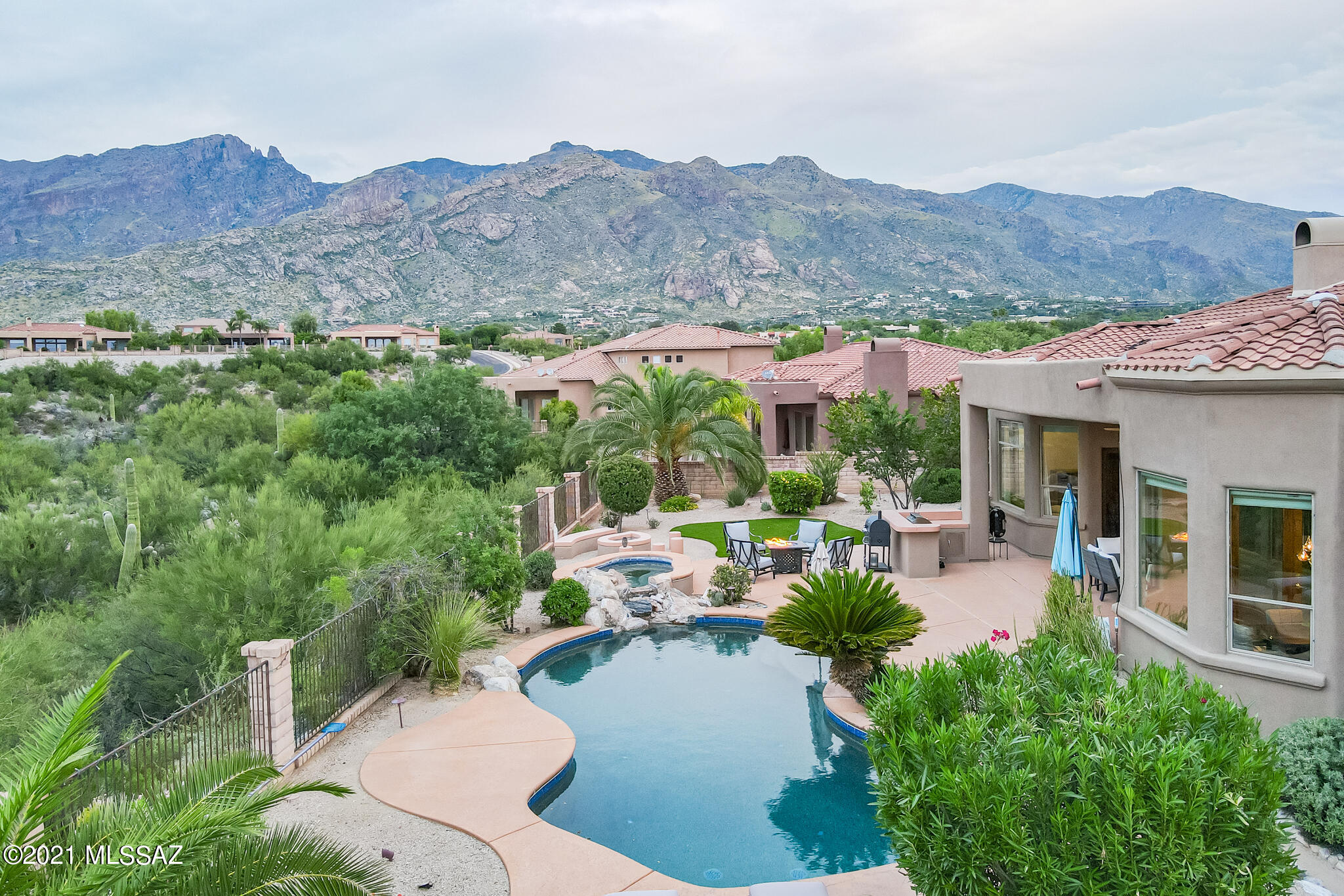 Updated Ridgetop Home in the Coveted, Gated Community of Pinnacle Ridge. Located on a Prime Lot In the Heart of The Catalina Foothills, This 4 BR & 4 BA Open Floor Plan Home Features Recent Improvements of 2 New Top of The Line HVAC units, Totally Remodeled Master Bath & Guest Suite Bath, New Carpet & Paint Throughout, All New Outlets, Wall Switches, & Can Lights, New Ceiling Fans, New Dining Room Chandelier, New Irrigation System and Back Patio Misters,  New Automated Pool & Spa, New Kitchen Refrigerator, and New Water Softener. Other Fine Features Include, a 3 Car Garage, Oversized Master Suite w/ Two Walk In Closets, Private Resort Like Back Yard w/ Pool, Spa, Built In BBQ,  Firepit, & Commanding Mountain & City Views!