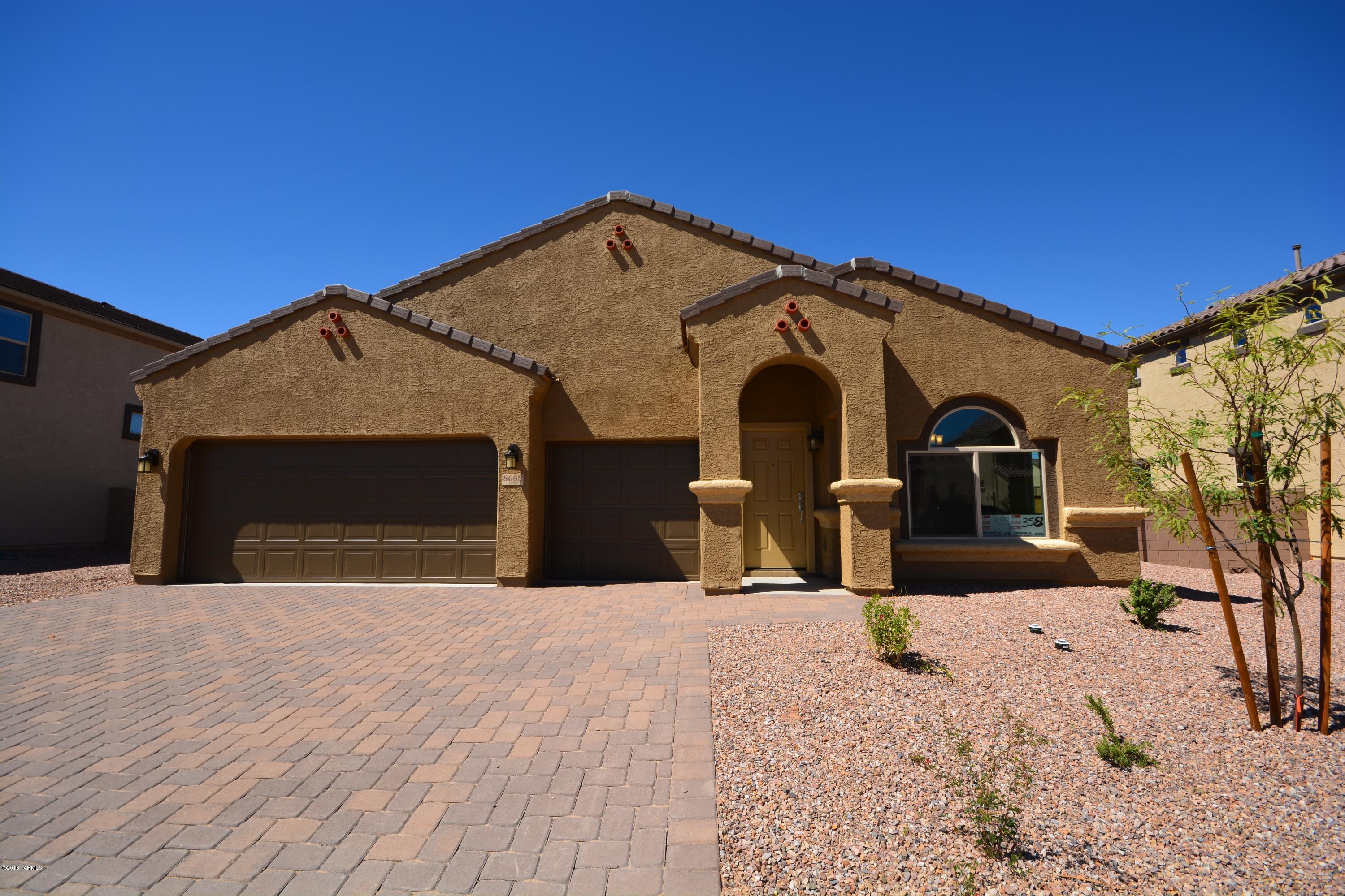 This popular floor plan comes with 3 bedrooms and a den.  The great room is off the kitchen with 9' ceilings giving this home an open spacious feeling.  The kitchen is nicely appointed with upgraded maple cabinets, hi-def counter tops and stainless steel appliances.  This home is also set up for outdoor living and entertaining with a huge extended patio. Additional features include 18 x 18 ceramic tile and upgraded carpet throughout, dual sinks at master. Brand new construction Energy Star Qualified Home which will save you up to 30% on your utility bills every month! Ready for move-in now.