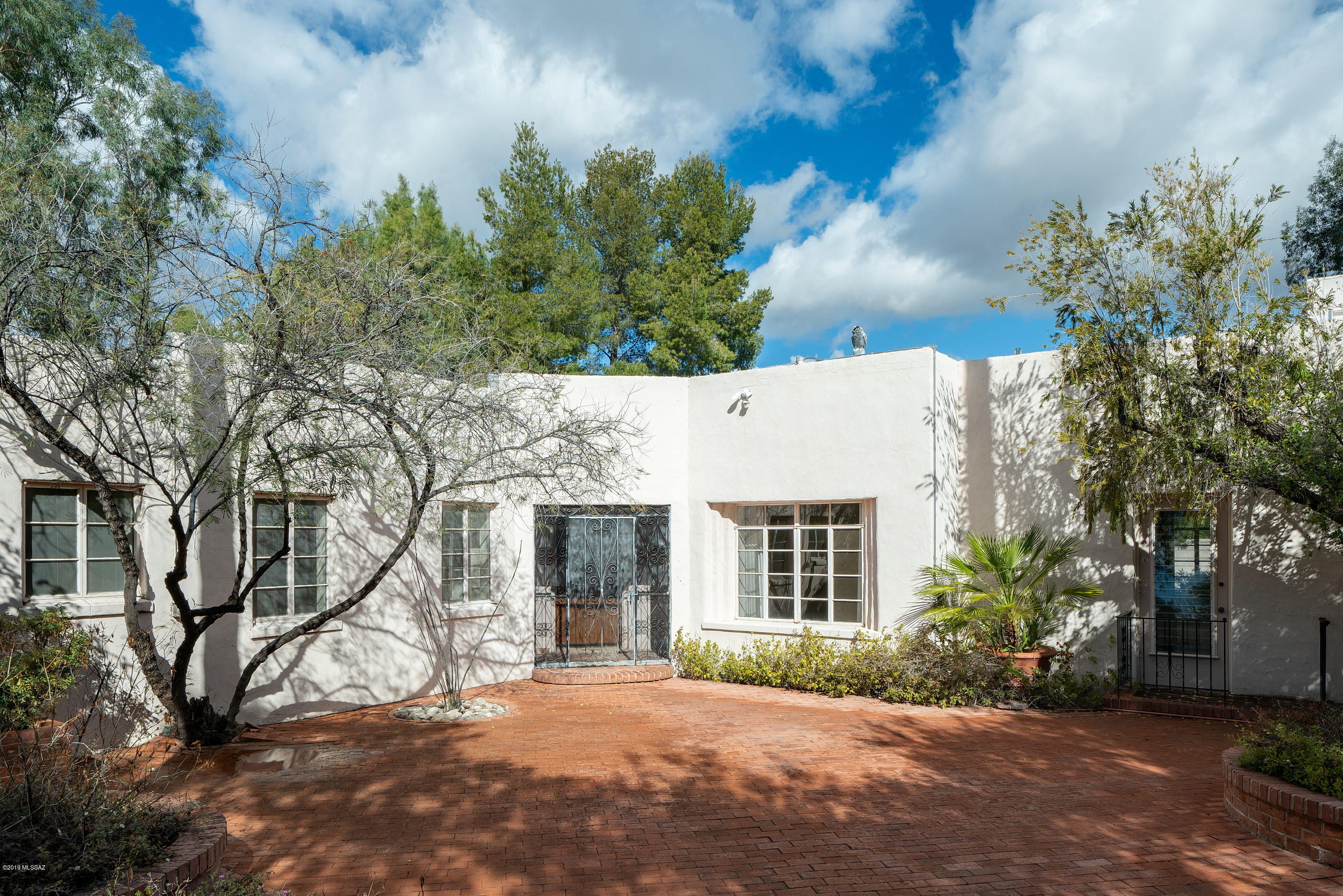 This is your chance to live in Historic El Encanto Estates. This centrally located home has been owned by 1 family since 1976. Over ½ an acre, 5 bedrooms and 4 bathrooms and 4433 square feet.  Home has many classic/unique features such as a large brick courtyard entry, butler's pantry, shaker cabinets and an indoor exercise pool added during 1977 remodel.  HVAC replaced approx. 2014. Backyard pebble-tec swimming Pool in a private enclosed yard. Up the outside staircase to an artist studio.  2-car garage and additional workshop. Close to U of A, Botanical gardens, shopping, medical facilities and downtown.