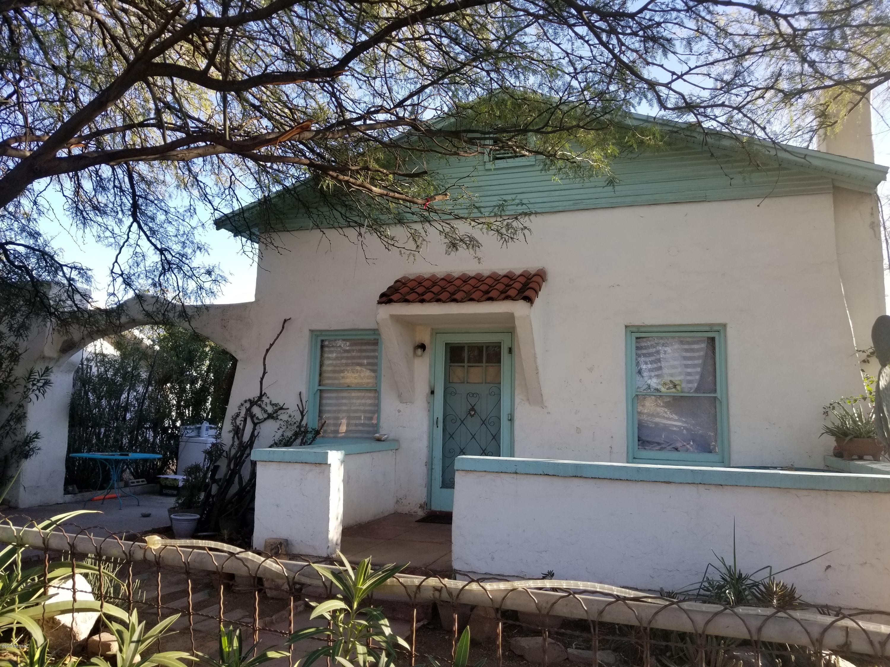 Fantastic property has Main House built in 1933 with basement and 2 guest houses (1934 & 1935) with income potential! Needs work. Beautiful courtyard. Carport is not currently accessible.