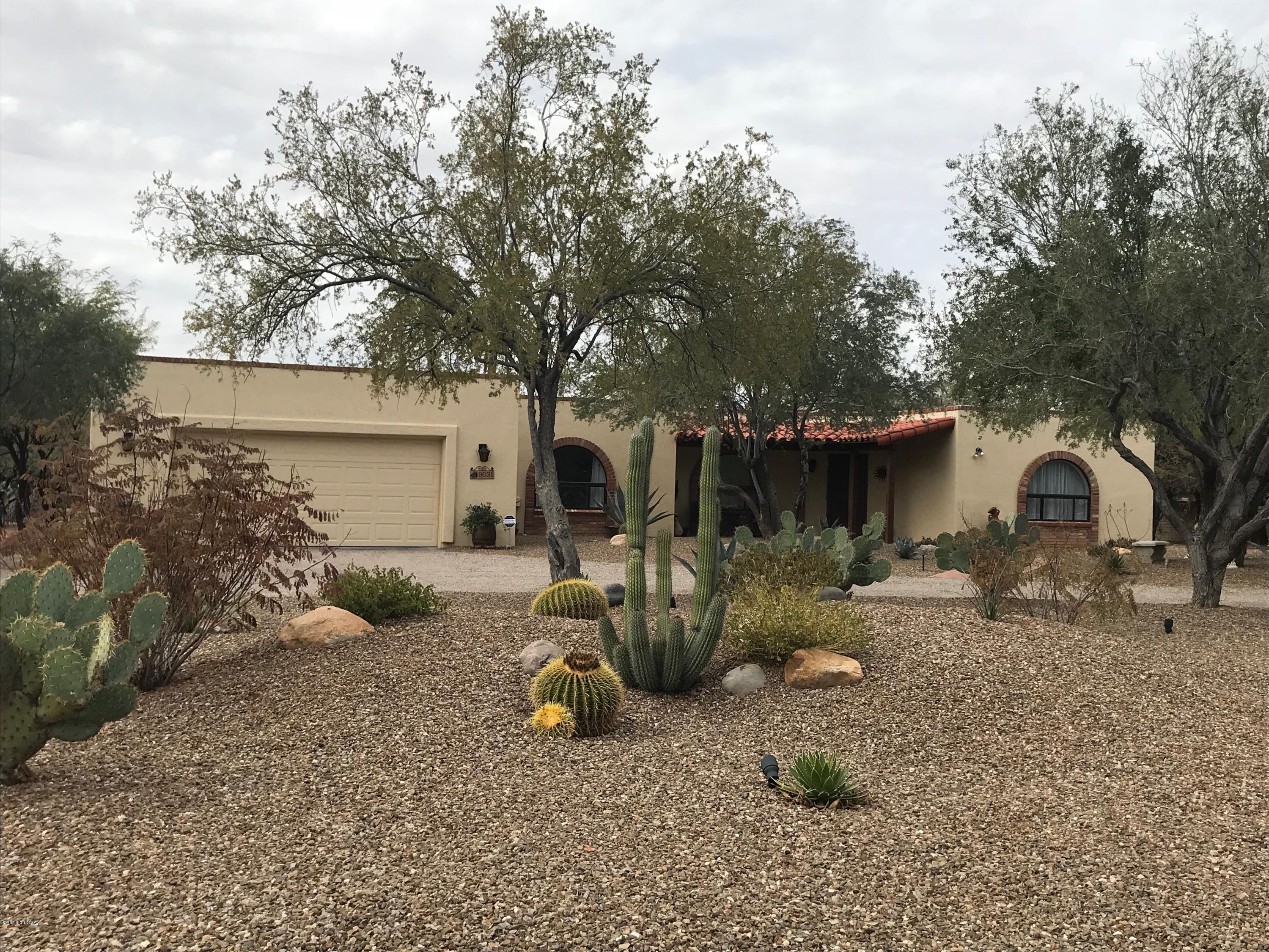 OPEN HOUSE SAT 3/10 12:00-3PM. Move-in ready home has been remodeled to perfection! Super classy upgrades & finishes will appeal to the most discriminating buyer. From end to end you will find the best, most current neutral colors, flooring, granite, lighting, appliances....it's all here and the work has been done for you! Split bedrooms - all with walk-in closets, open-concept floorplan, arched windows, skylights and big Catalina mountain views. Even the front and back landscape are meticulously detailed and highlight the desert plantings, the sparkling pool, covered patio areas front & back, and sitting and entertaining areas. The parcel extends far beyond the enclosed yard and offers privacy and views for enjoyment of your country club estates home. Just move in and enjoy!