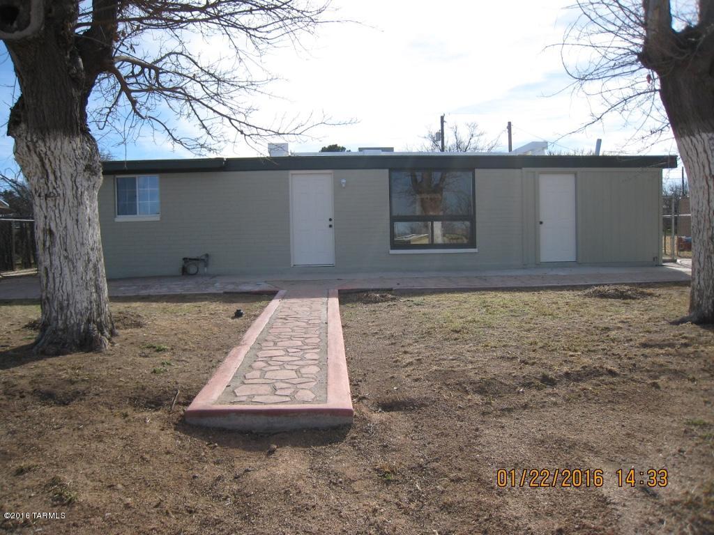 A must see! Beautifully redecorated 3 bedroom, 2 bath home. Everything is NEW including kitchen, bathrooms, furnace, air conditioner, hot water heater and floor tile. Newly painted interior & exterior. New roof in 2012. Kitchen is beautifully finished with new cabinetry and tiled countertops. New bathroom vanities with tiled countertops. Ceiling insulated with foam and drywall. All new ceiling fans & fixtures throughout. There is a 4th room which could be used as a bedroom, den, storage etc. Large laundry room & a big back yard. 12 x 14 Storage Shed. Walking distance to Benson schools & library. Listing Agent is related to Seller.