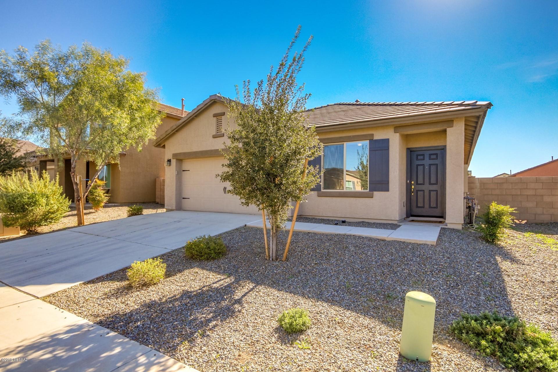 Fantastic 3 bed 2 bath home with den & 2 car garage in Sonoran Ranch. Open concept kitchen features stunning granite counter-tops with full decorative back-splash, beautiful cabinets with crown molding offering plenty of storage & built in pantry closet. Appliances include black OTR microwave, new gas range & new dishwasher. Spacious floor plan with ceramic tile flooring in kitchen, dining, laundry & bathrooms. New plush carpet in the living room, den & bedrooms. Split floor plan with large master suite. Master bathroom has garden tub, walk-in shower, private toilet room & roomy walk-in closet. New interior paint. Great curb appeal with easy care landscaping featuring mature trees, shrubs & deco rock. Private back yard with covered patio & deco rock. Move in ready, come see it today!