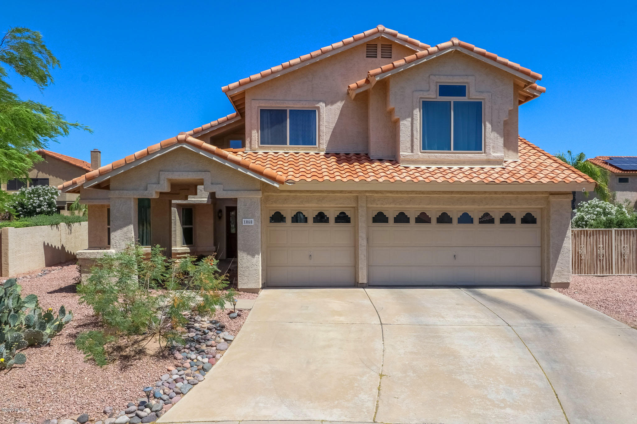 SEE VIDEO TOUR IN MLS of this Beautiful, bright and spacious 2 story, 3 BR 2 BA, 2,255 Sqft home in desirable Copper Creek Community!  Welcoming curb appeal, Cul-De-Sac Lot, 3 Car Garage & Sparkling Pool ALL sitting on a LARGE .21 acre lot! Prepare to relax in your large master suite with sitting room/office area attached, gather around your cozy wood burning fireplace in the family room or hang out in private back yard.  Home boasts vaulted ceilings, formal dining room w/bay window, energy efficient windows, laundry room with easy access to pool (no tracking water through home!), Mature Landscaping including citrus trees, roses and more.  Walking distance to Neighborhood Park and Elementary School! Close to Oro Valley Hospital, Oro Valley Marketplace and Catalina State Park!