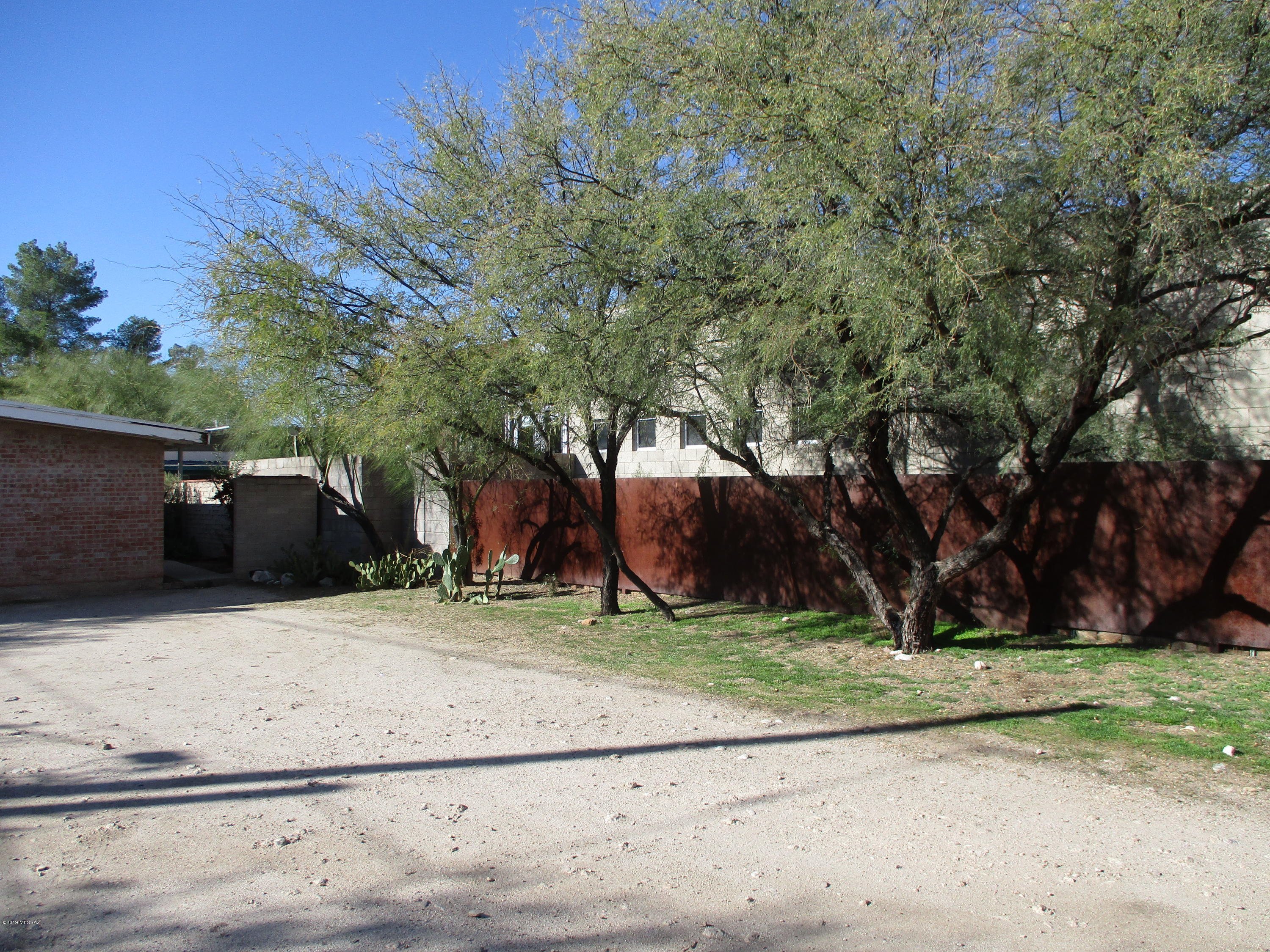 Great Opportunity to own a red brick triplex in Sam Hughes Neighborhood. Property is two blocks to Sam Hughes Place and one block to Sun Trans bus line stop on 6th Street. Nine off street parking spots & permit parking on Olsen Ave. Also just blocks to U of A campus. Call listing broker for more information.