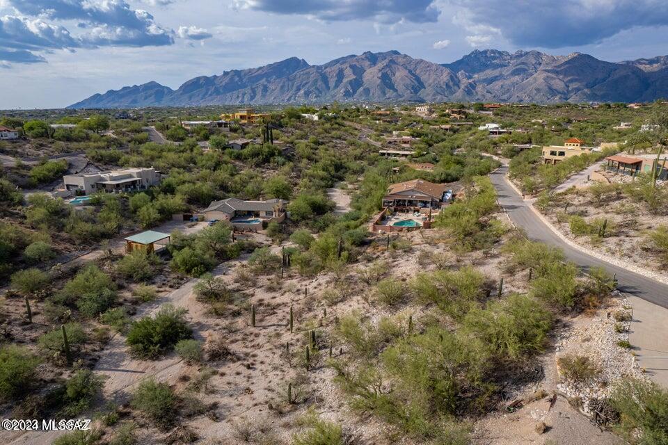 Seller will consider offers between $100,000-$125,000. Discover your desert oasis in La Buena Vida Estates. Subdivided lot ready for your custom home. Utilities to the lot line. Serene mountain/city views, and wildlife ambiance. Proximity to schools, shops, Sabino Canyon, UofA and downtown. Elevate your lifestyle - seize this opportunity now!