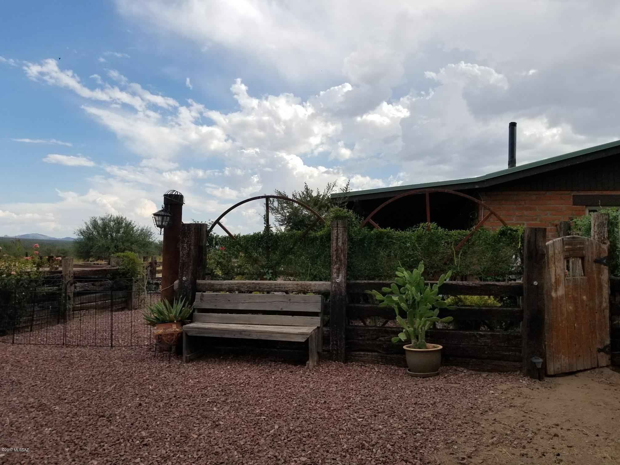 A beautiful ranchette on 5 acres in Amado. Unobstructed views of the Santa Rita Mountain Range. This 2 bedroom 2 bath home has plenty of room for horses or just a quiet retreat for watching the sunset.